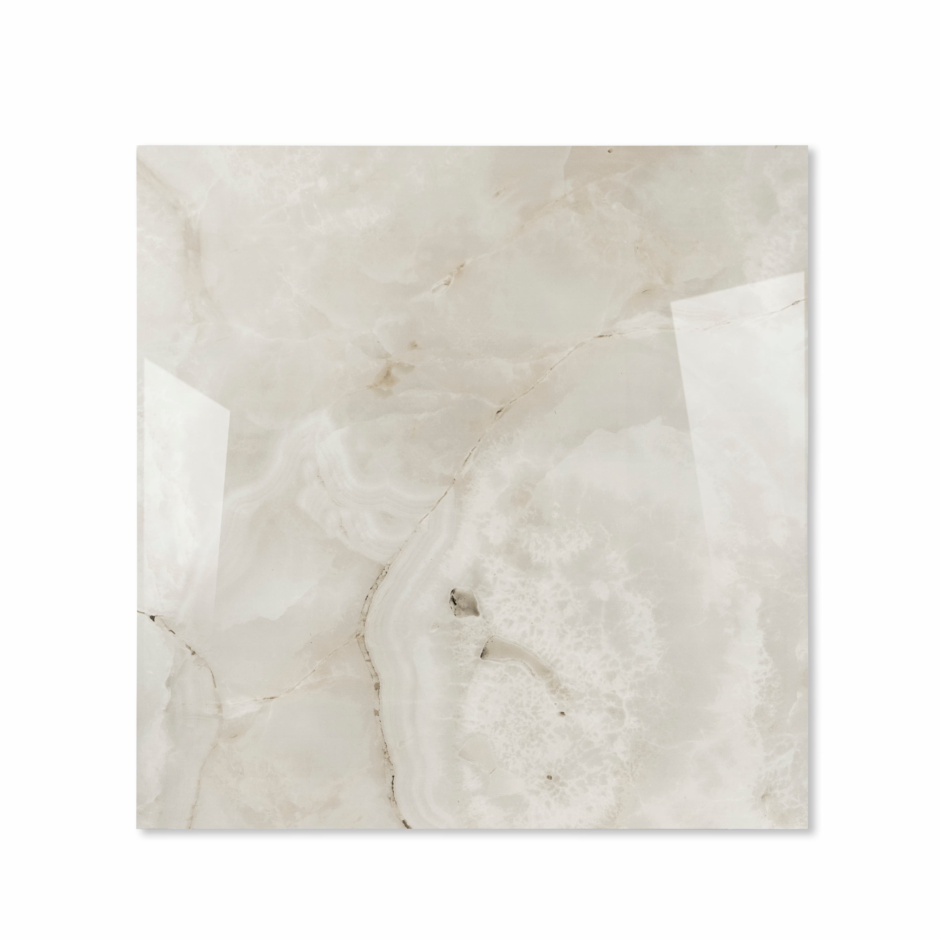 Top view of Marbella Gold ivory onyx-effect porcelain tile with agate swirls and gold veining