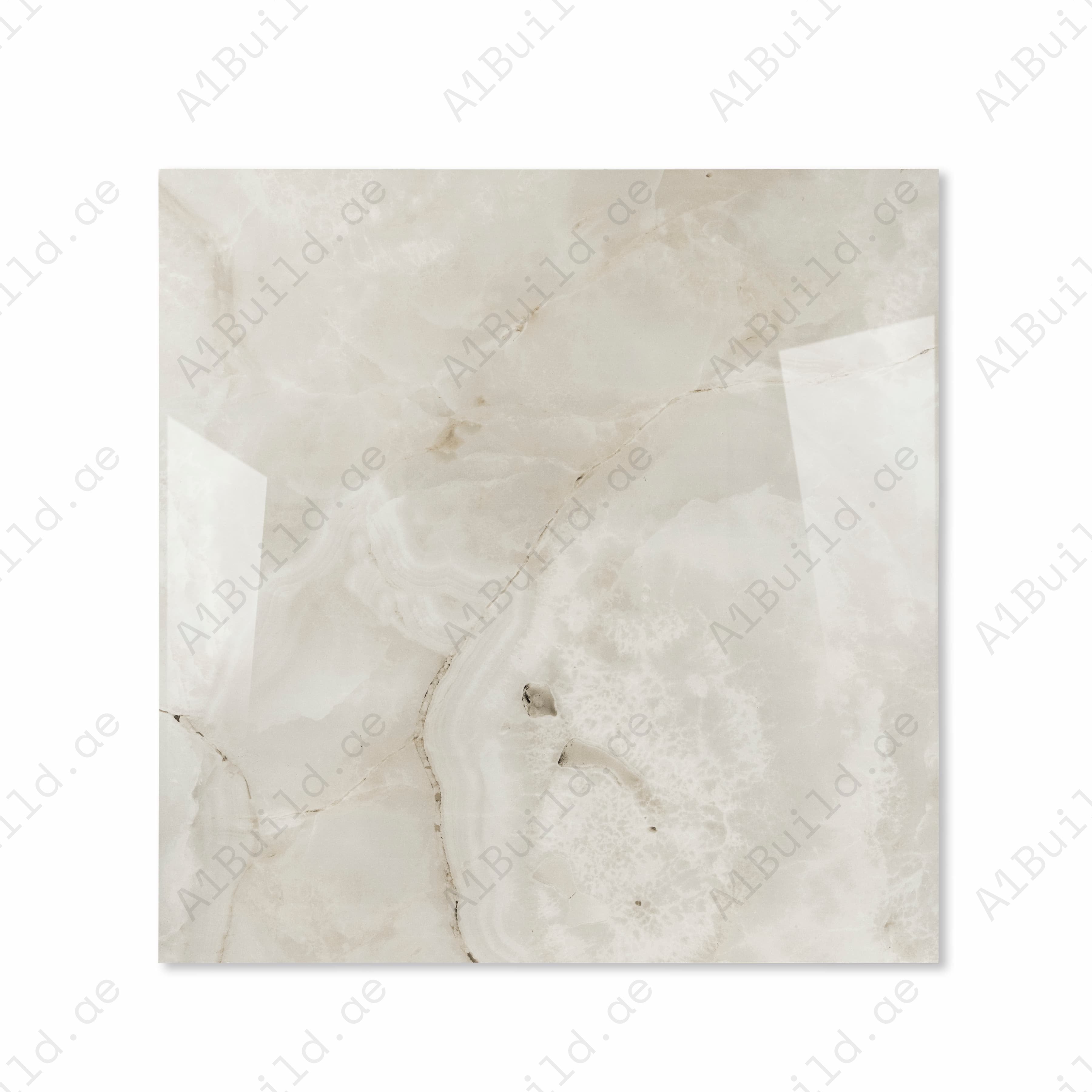 Top view of Marbella Gold ivory onyx-effect porcelain tile with agate swirls and gold veining