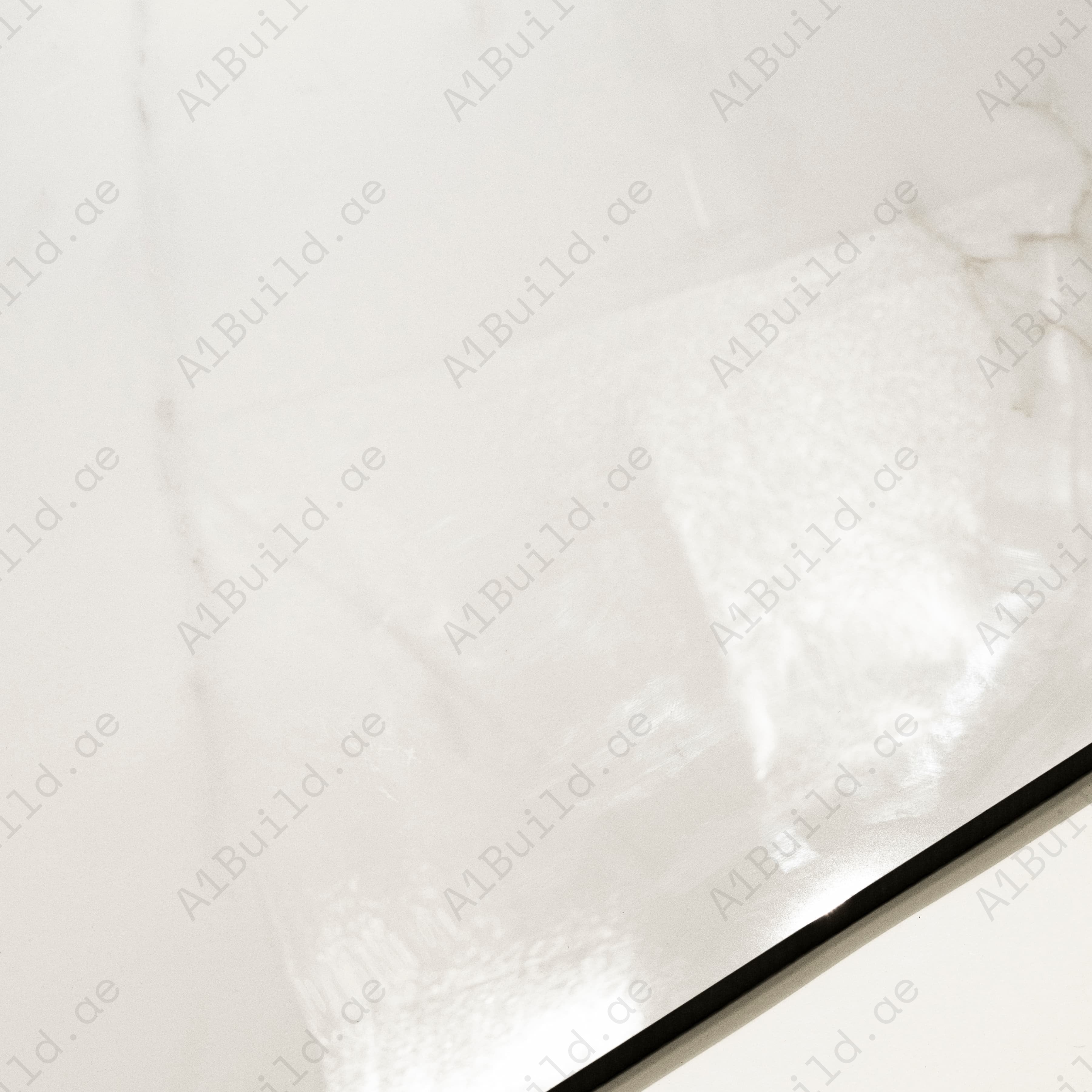 Close-up detail showing the soft pale veining and mirror-gloss surface of Smoke White porcelain tile