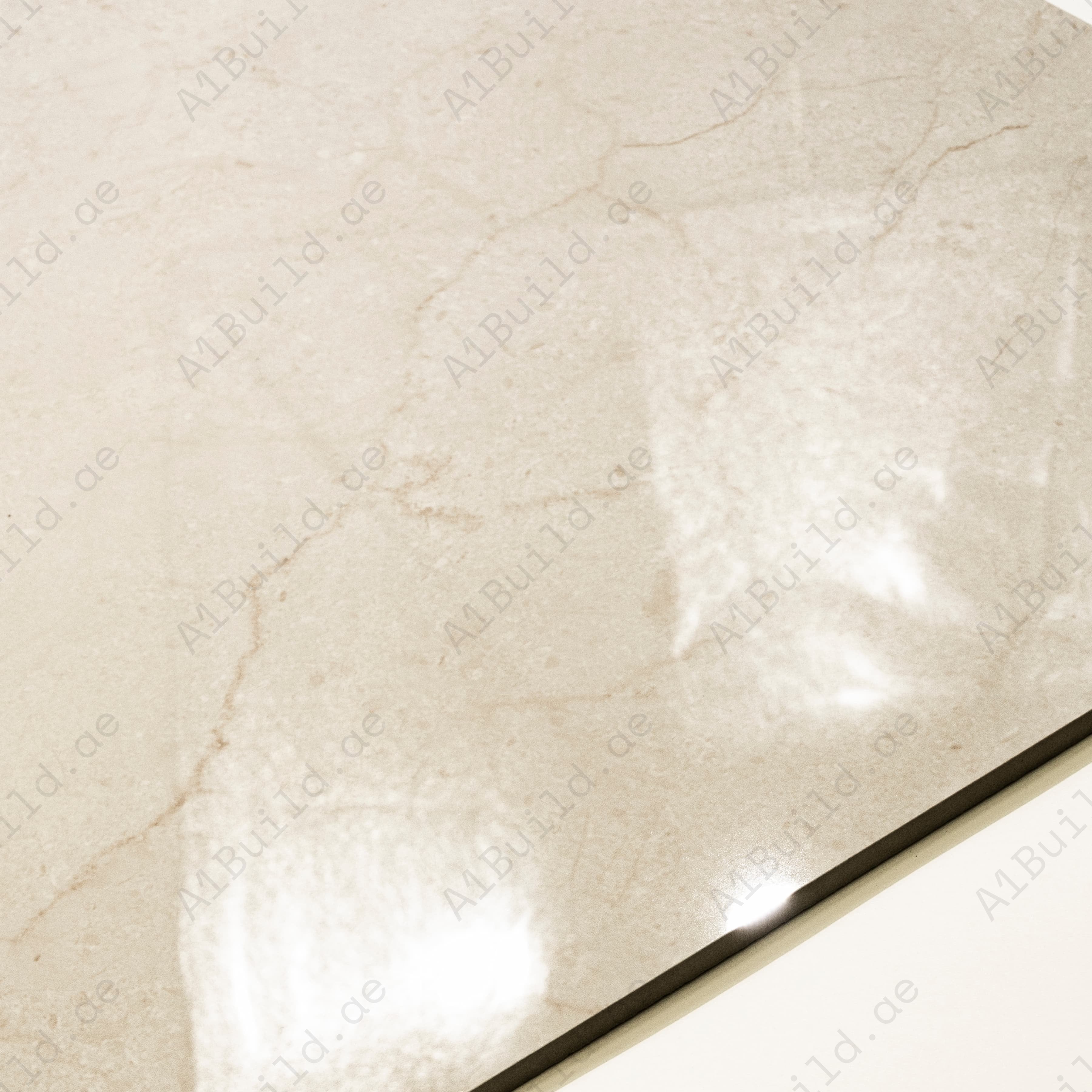 Close-up detail showing the delicate honey-caramel veining and mirror-gloss surface of Ultimate Marfil Pro porcelain tile