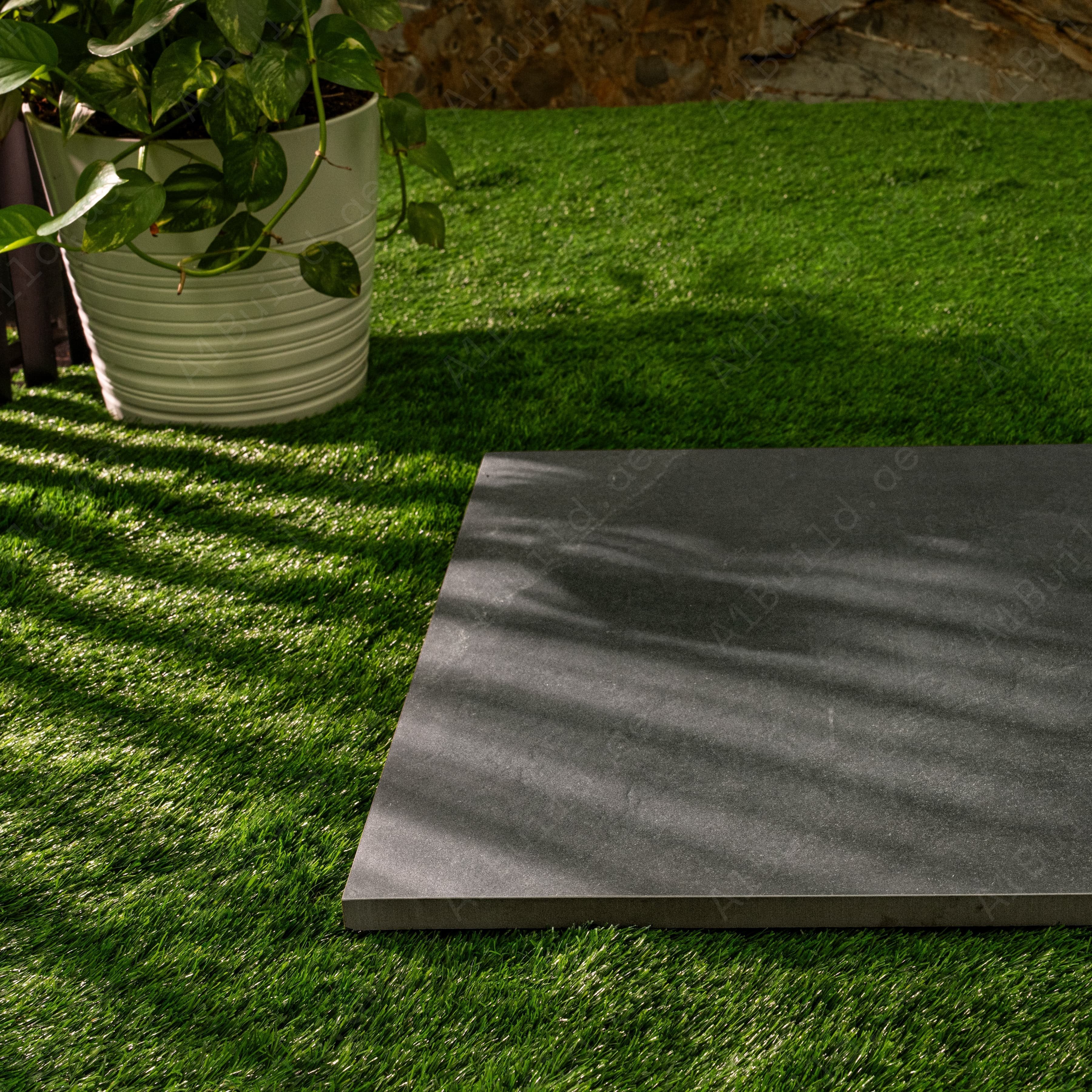 New Brazilian Black porcelain tile displayed in a styled interior setting
