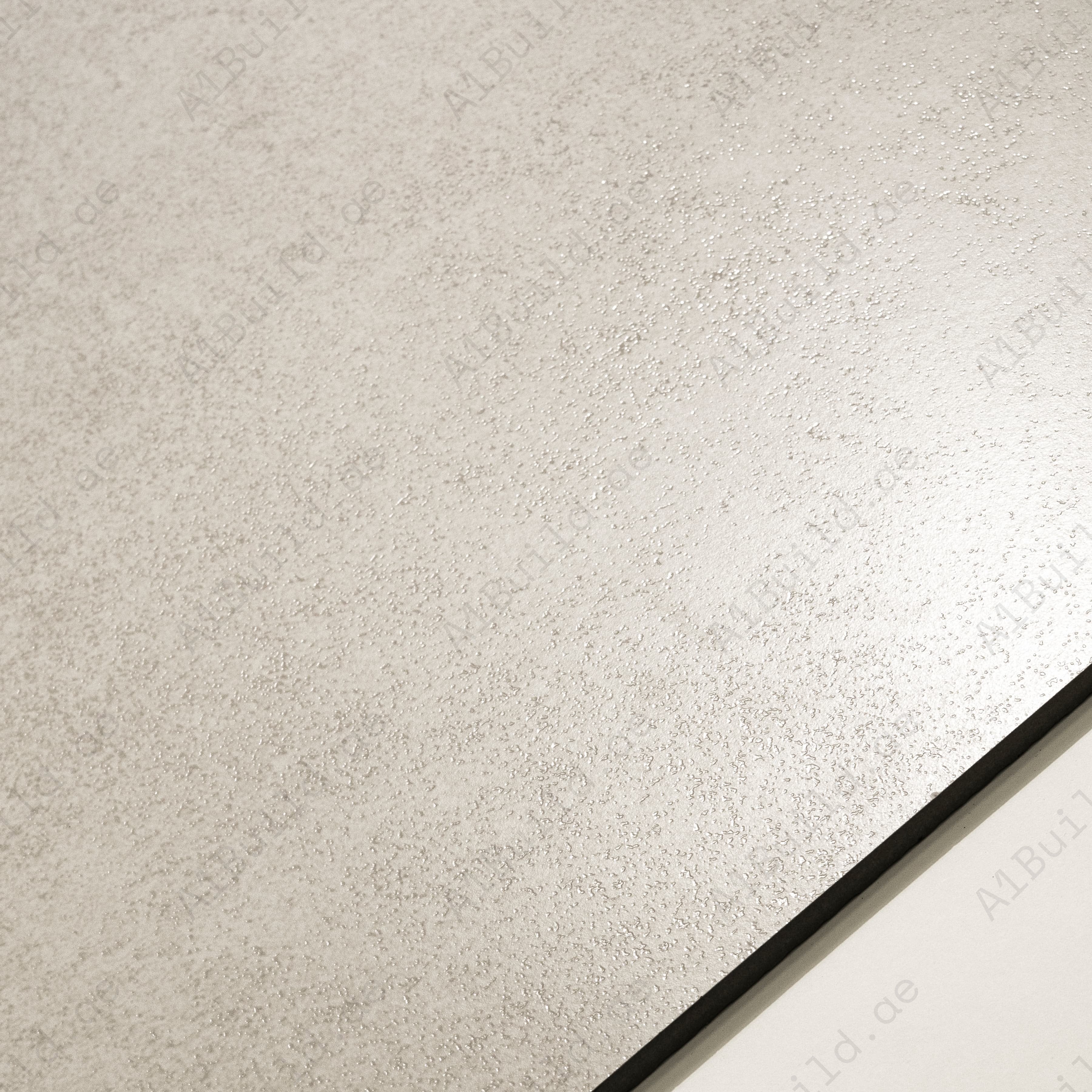 Close-up of Norway Cemento Bianco matte porcelain surface revealing fine grainy concrete texture in warm white tone