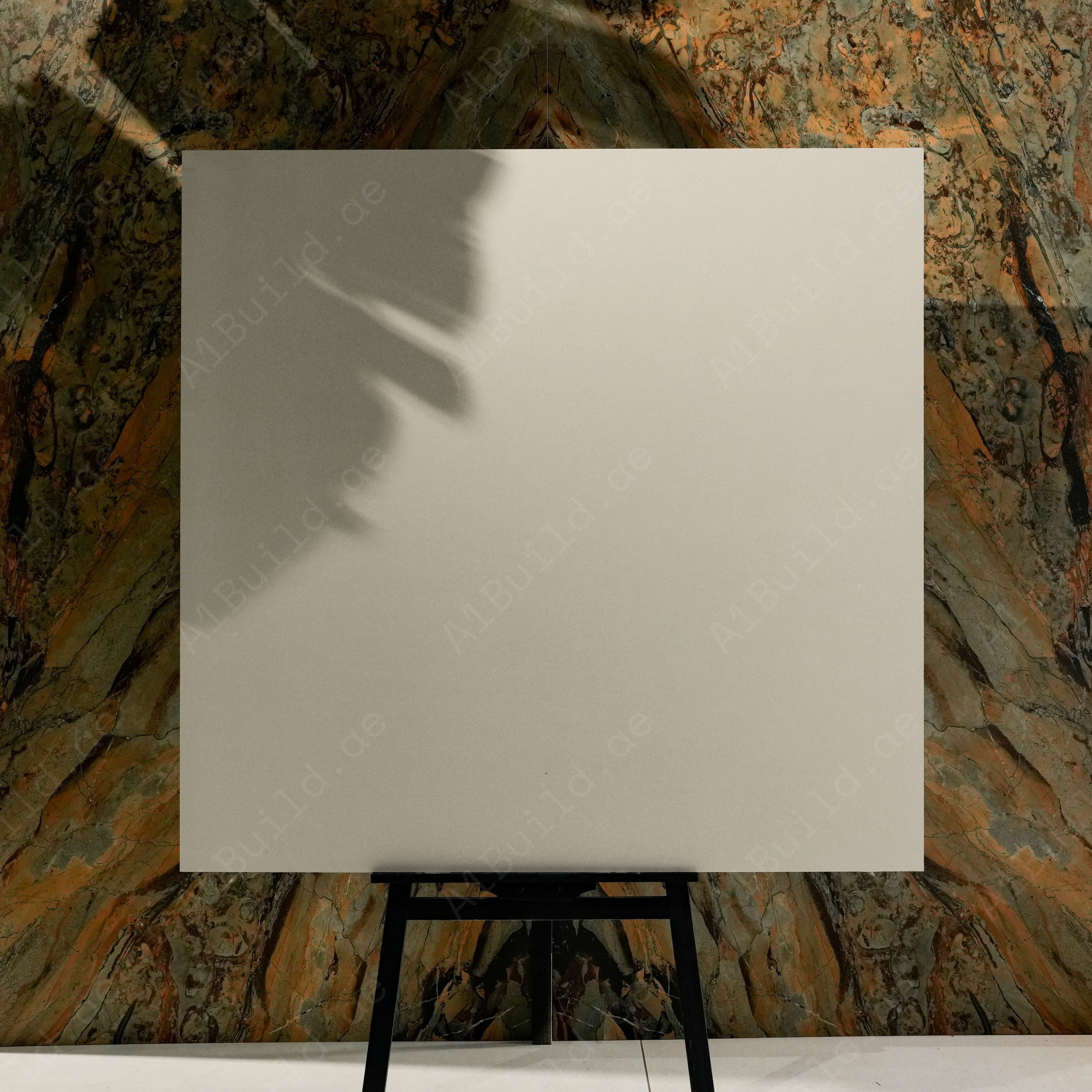Santorini Light 120x120cm matte porcelain tile on easel against onyx marble backdrop in UAE luxury tile showroom