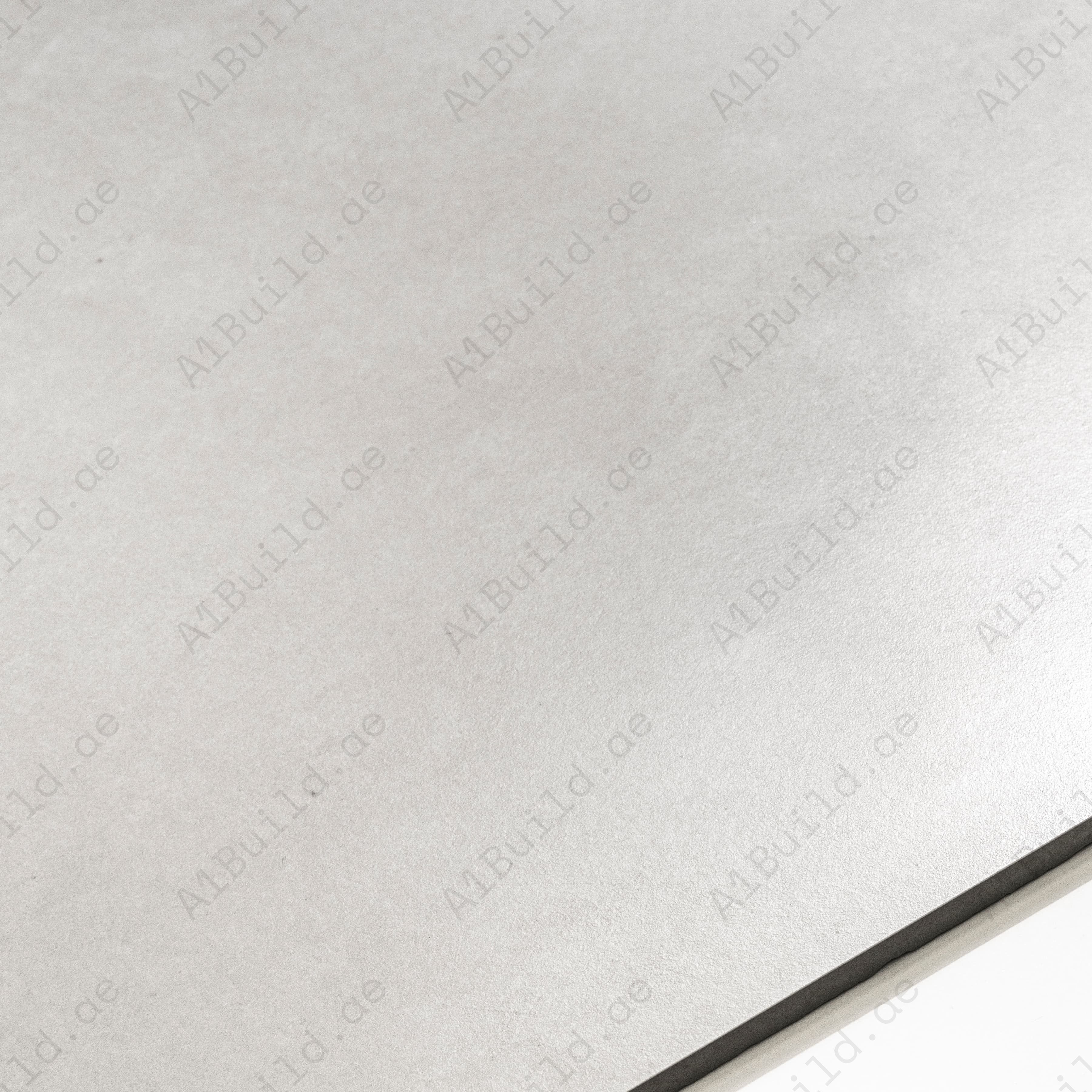 Close-up of Azure Bianco matte porcelain tile surface showing subtle cement-inspired texture and 9mm thickness