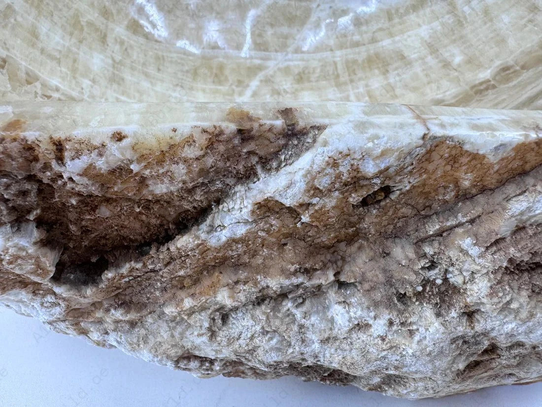 Add a touch of luxury with the Marble Muse Yellow Onyx Irregular Wash Basin, crafted from natural marble for timeless beauty, unique form & lasting durability.