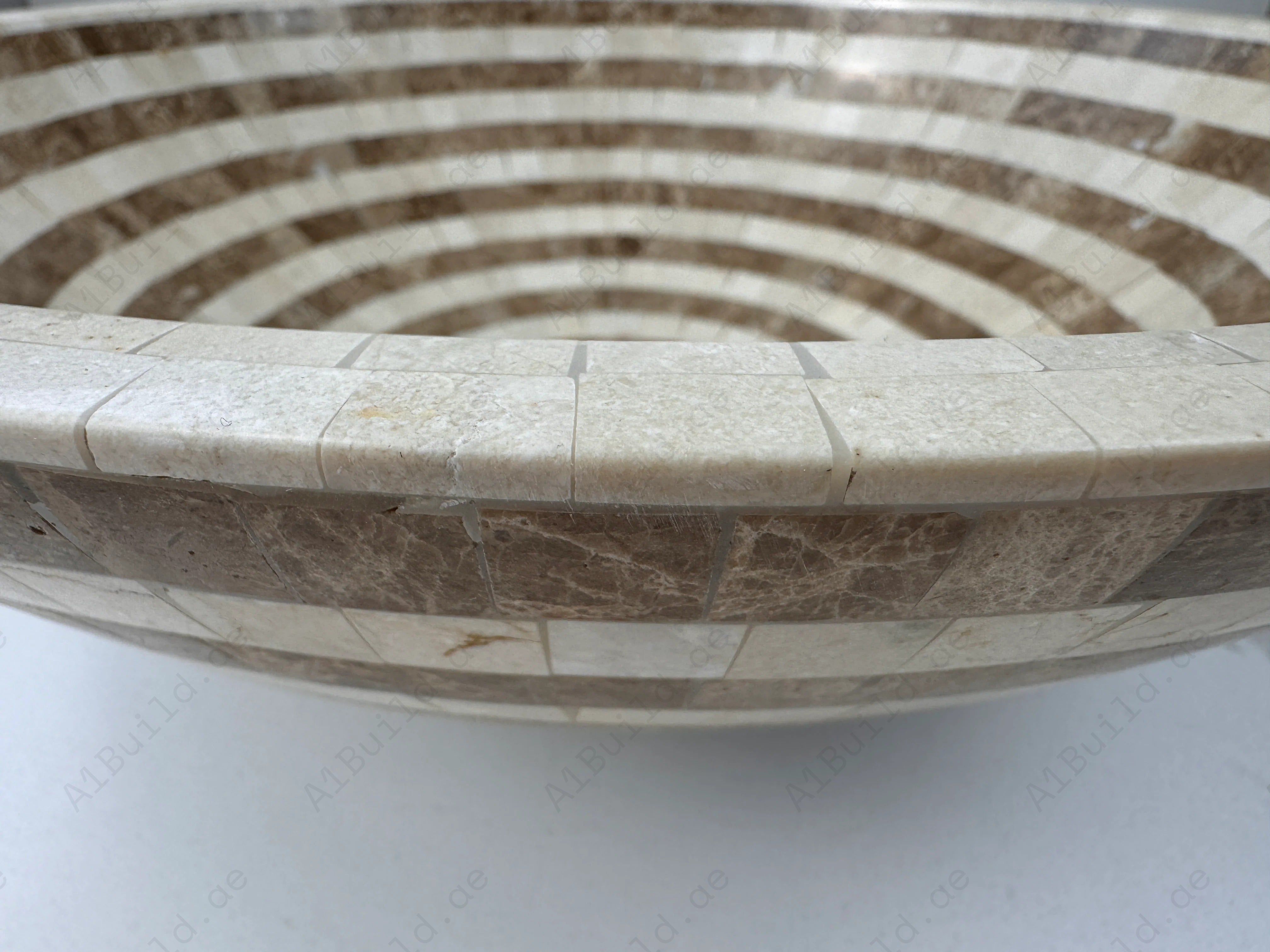 Add timeless charm to your bathroom with the Marble Muse Light Emperador & Crema Marfil Round Marble Basin, blending natural elegance with polished durability.