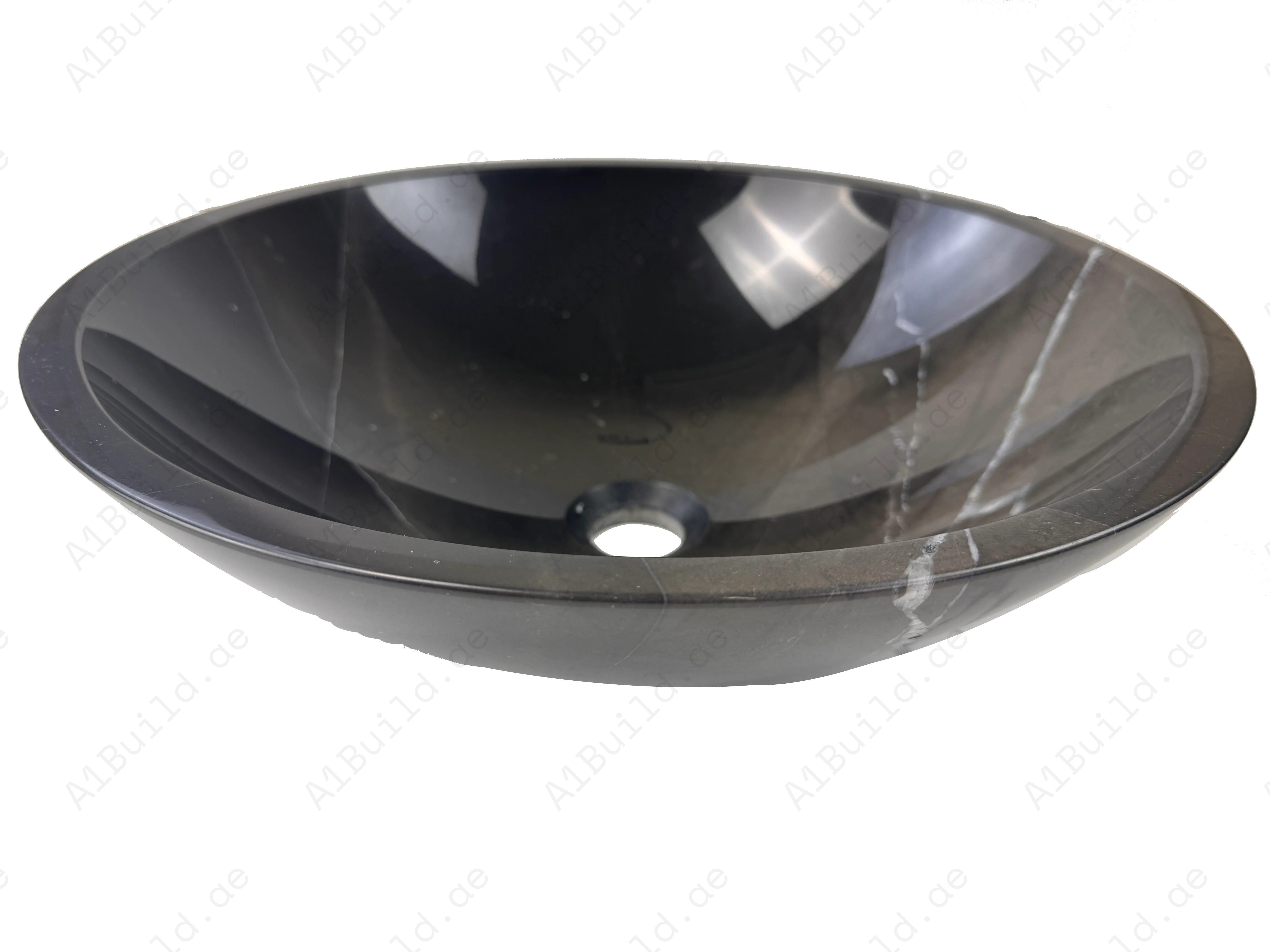 Elevate your bathroom with the Marble Muse Black Marquina Polished Round Wash Basin, crafted from premium marble for bold elegance and timeless appeal.