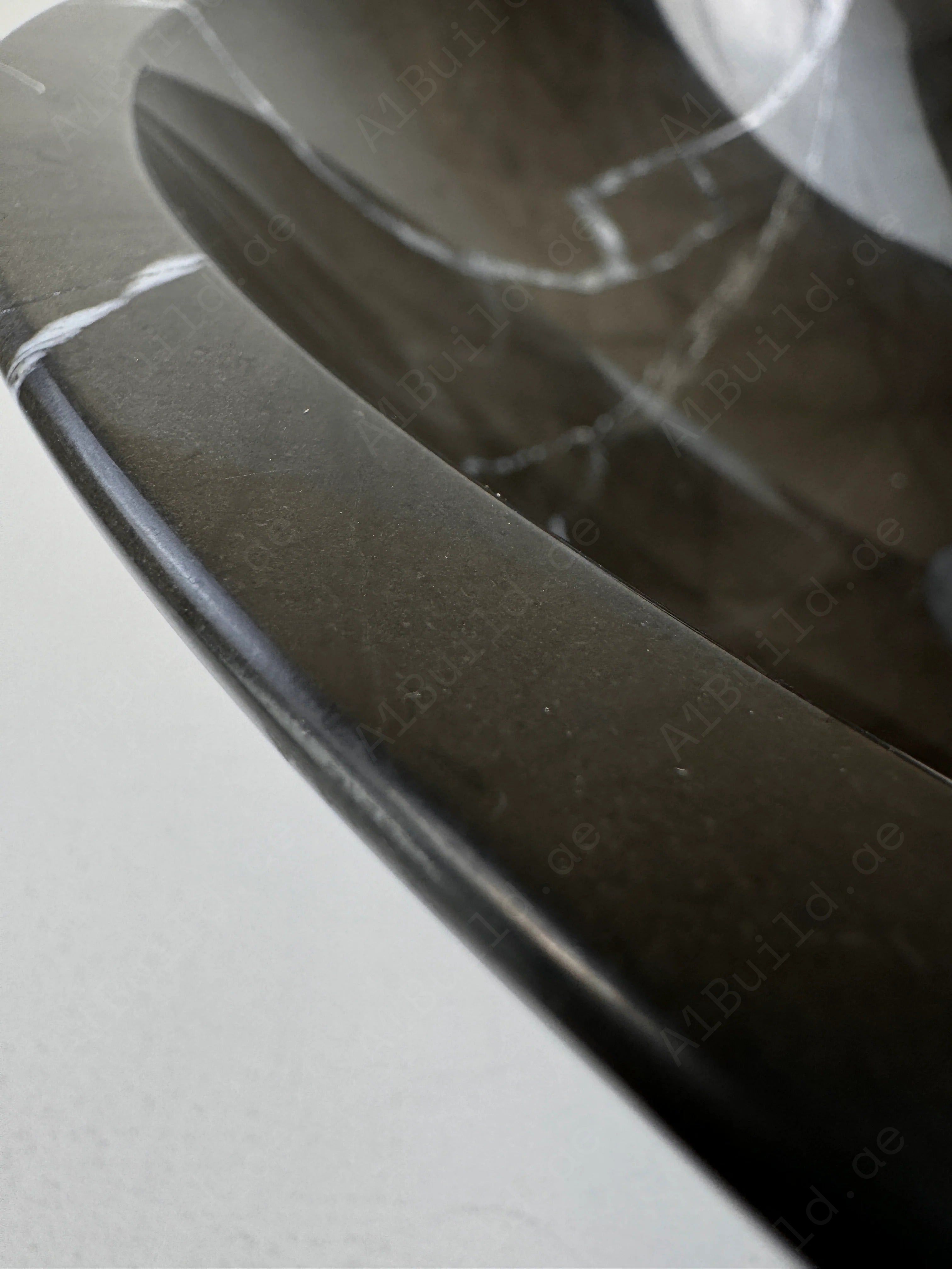 Elevate your bathroom with the Marble Muse Black Marquina Polished Round Wash Basin, crafted from premium marble for bold elegance and timeless appeal.