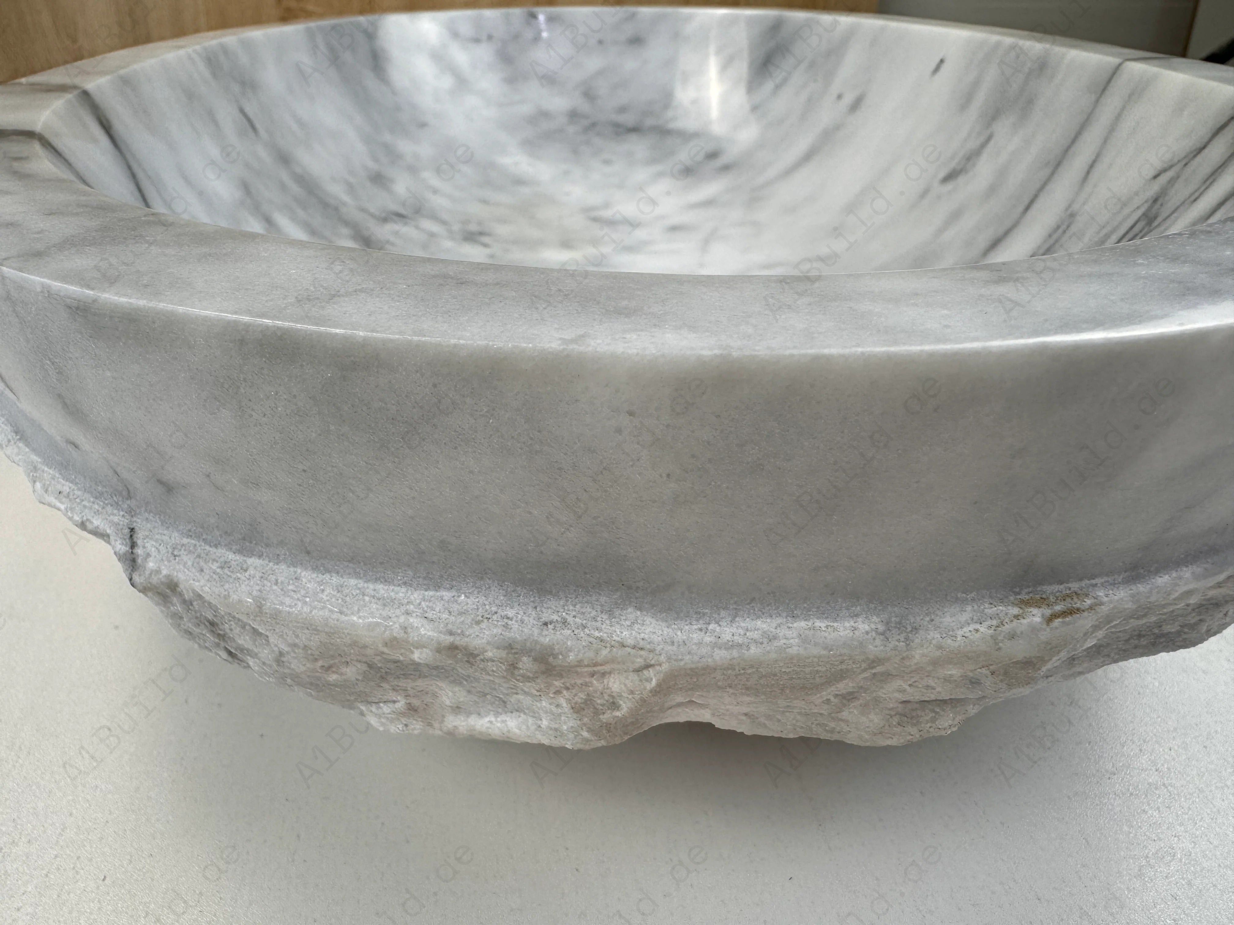 Elevate your bathroom with the Marble Muse Carrara White Natural Elliptical Wash Basin, crafted from premium marble for timeless elegance and lasting beauty.