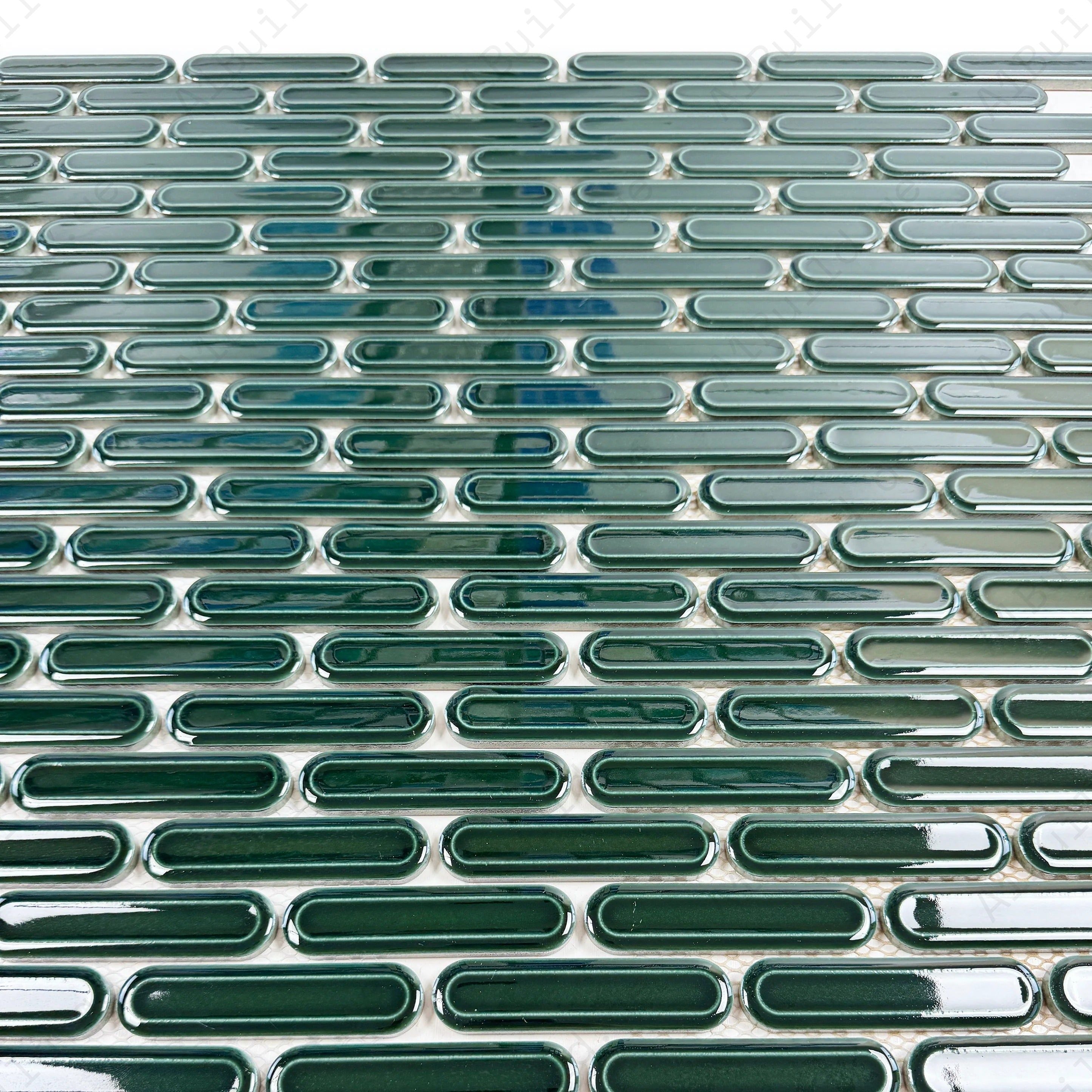 Emerald green elongated oval glossy porcelain mosaic, ideal for walls, backsplashes, and modern interiors with vibrant, sleek, and elegant appeal.