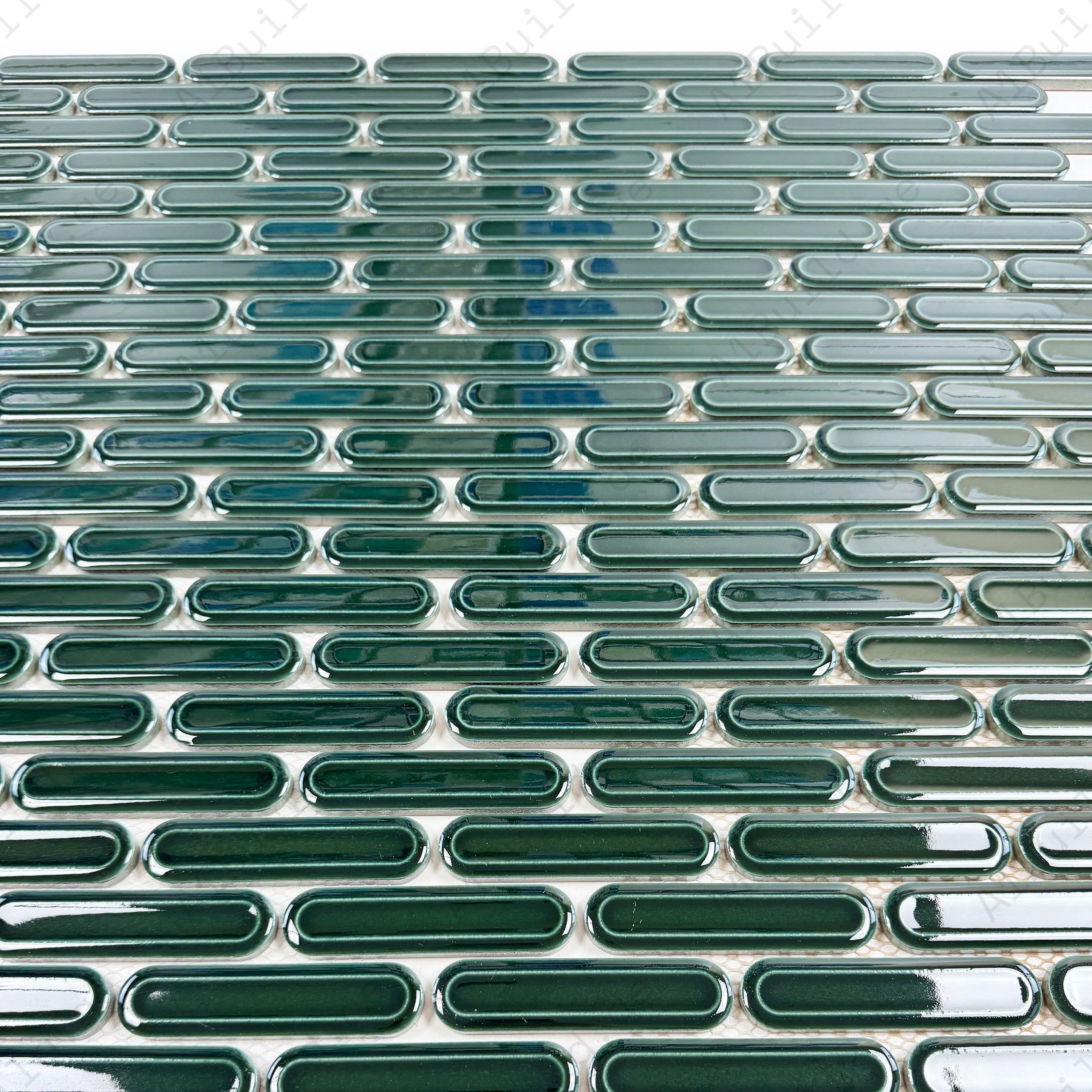 Emerald green elongated oval glossy porcelain mosaic, ideal for walls, backsplashes, and modern interiors with vibrant, sleek, and elegant appeal.