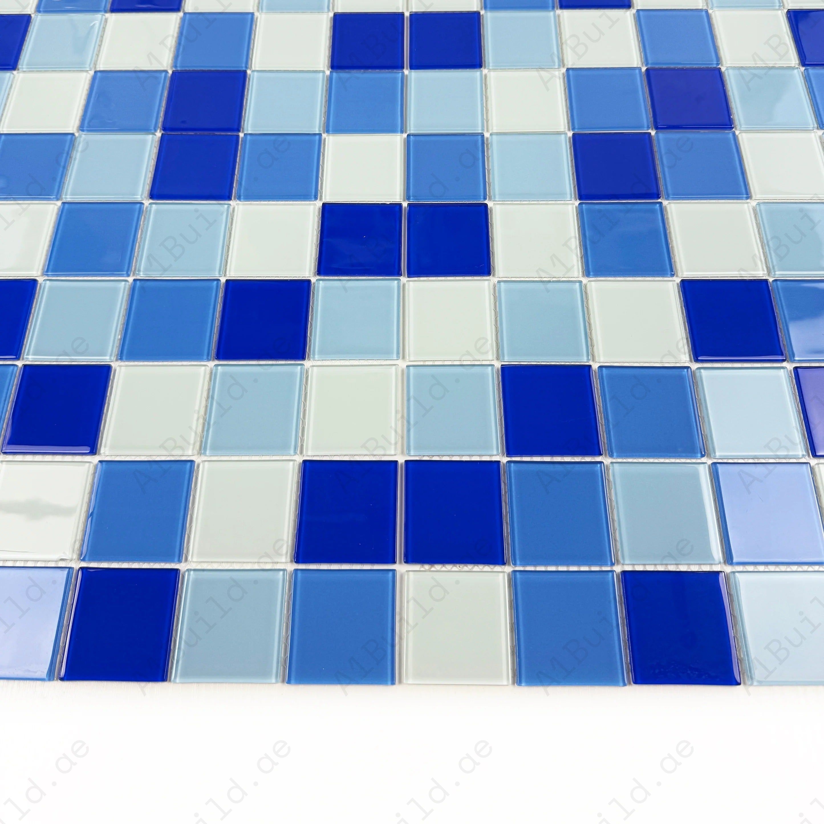 Enhance your space with White, Sky Blue, French Blue & Navy Blue Crystal Glass Mosaic tiles. Durable, waterproof & ideal for pools, spas, kitchens & bathrooms.