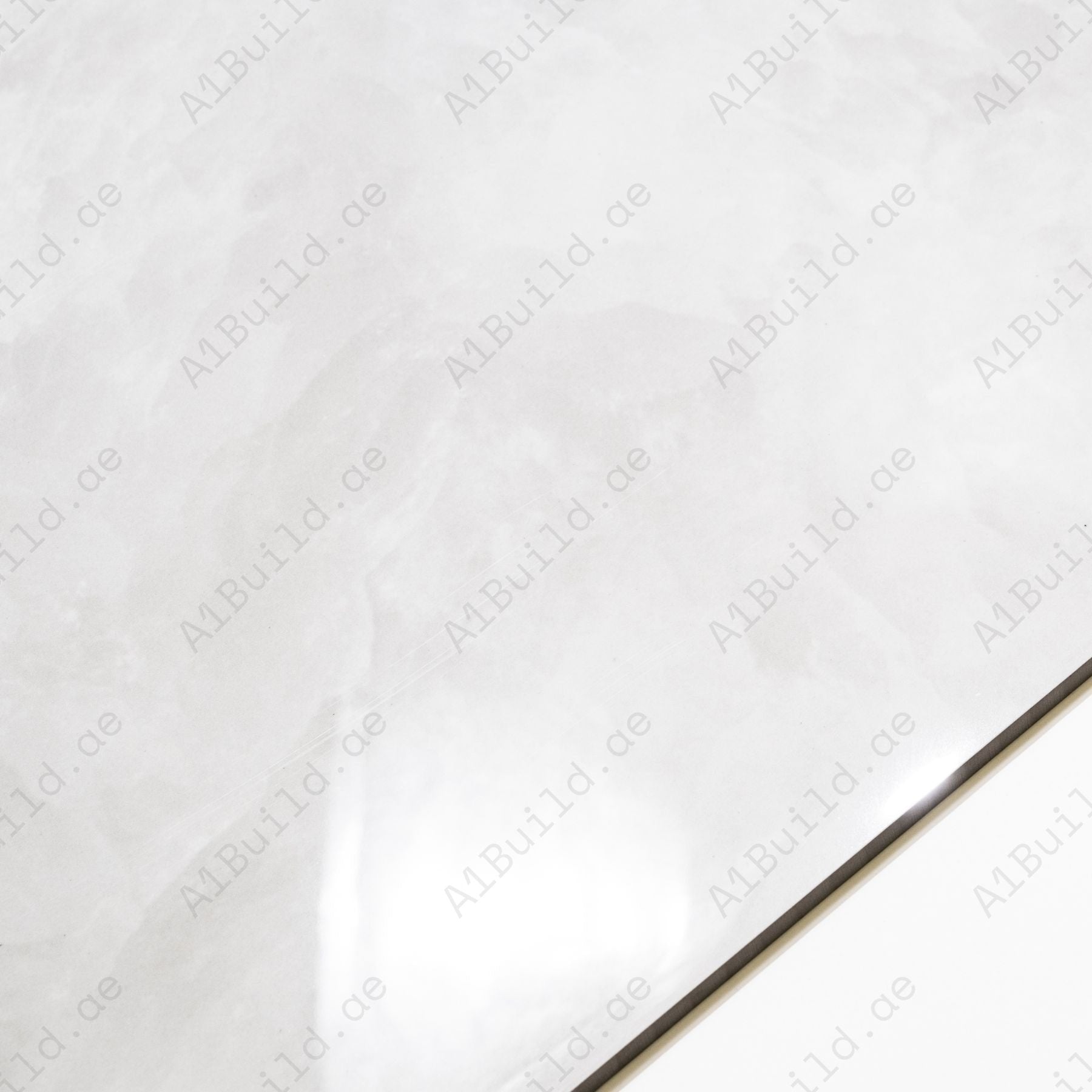 Fur Ice glossy marble effect porcelain tile 60x120cm with 9mm thickness features icy white base, soft grey texture and polished finish.