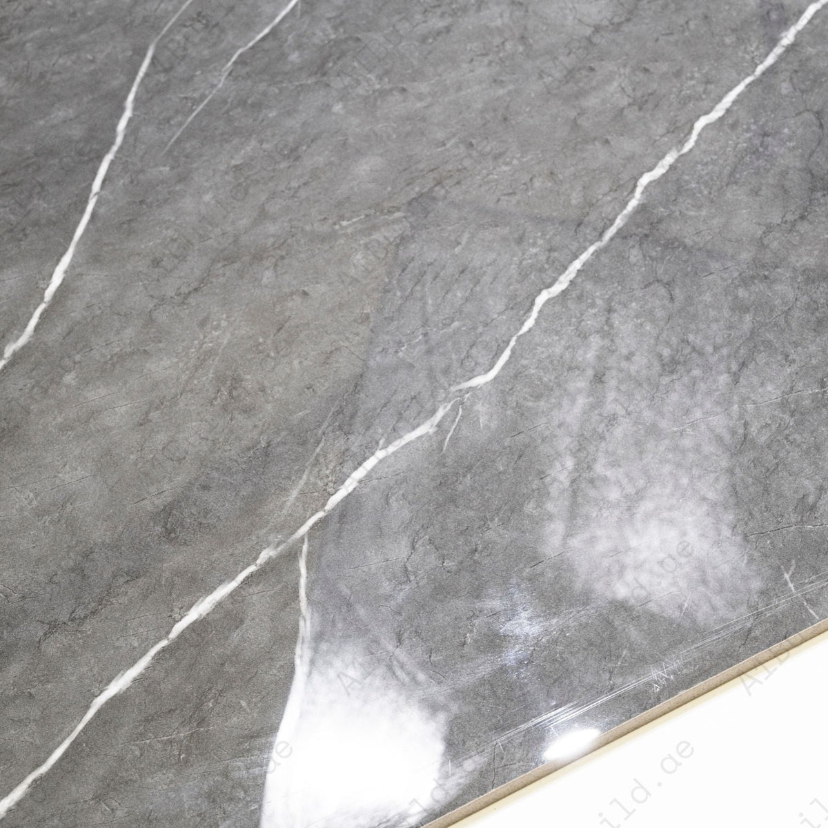 Graphite Vein glossy porcelain tile 60x120cm with 9mm thickness features dark graphite base, elegant veining and refined polished finish.