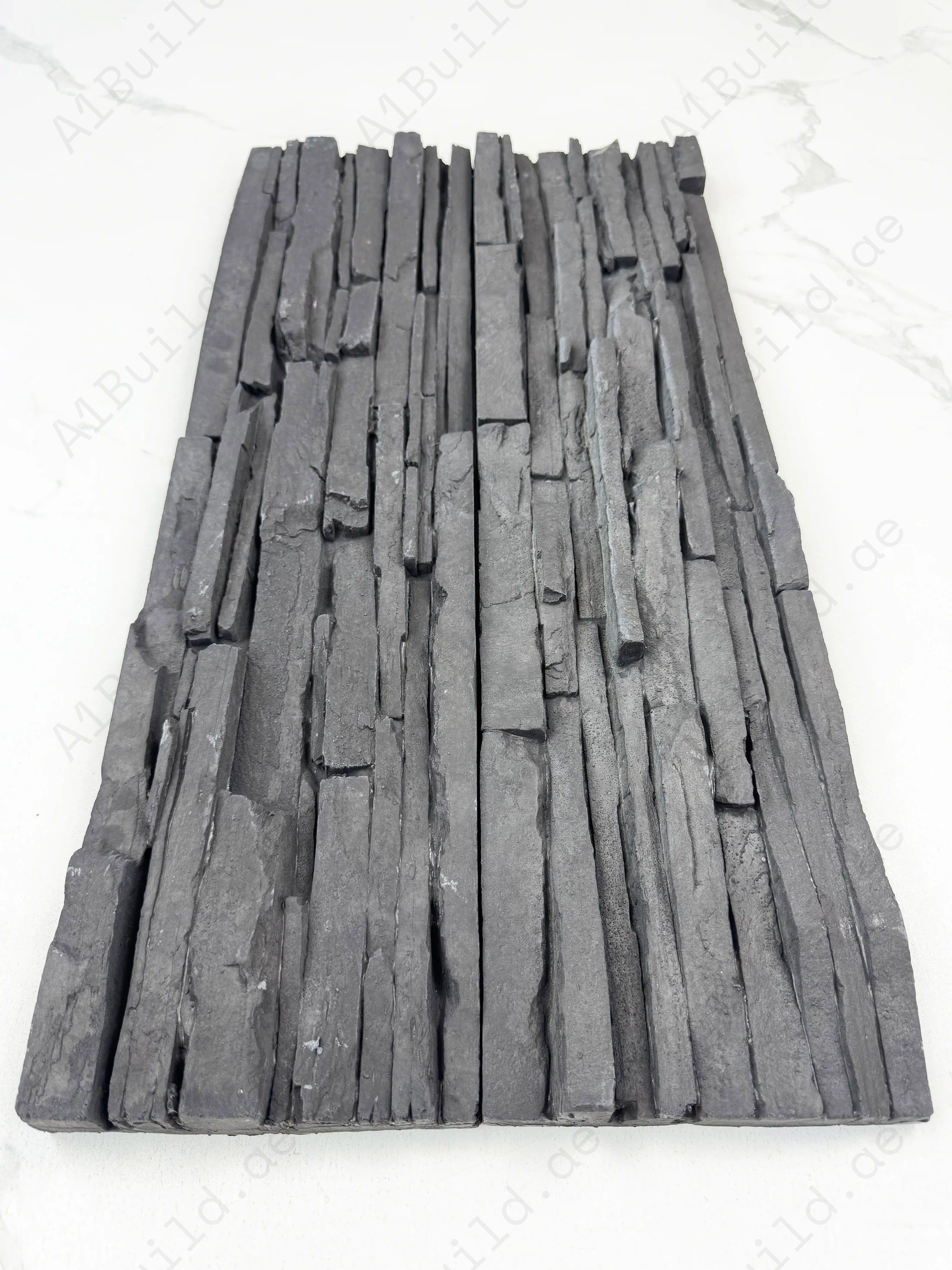 Upgrade interiors with Tuscany Essence Iron Grey Cement Artificial Tile. Strong, modern split surface design perfect for walls, accents, and décor projects.