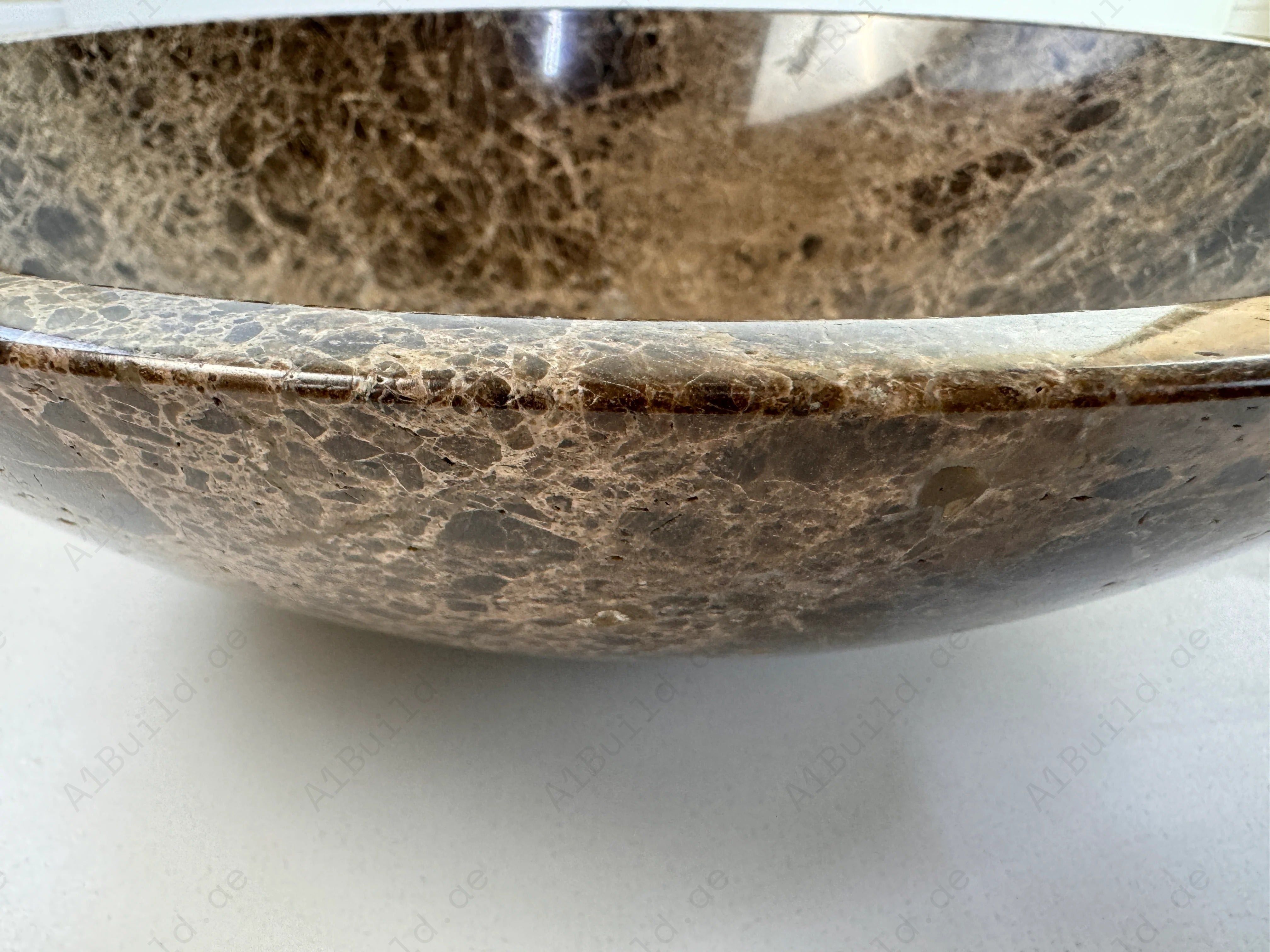 Upgrade your bathroom with the Marble Muse Dark Emperador Polished Round Wash Basin, crafted from premium marble for timeless elegance and refined luxury.