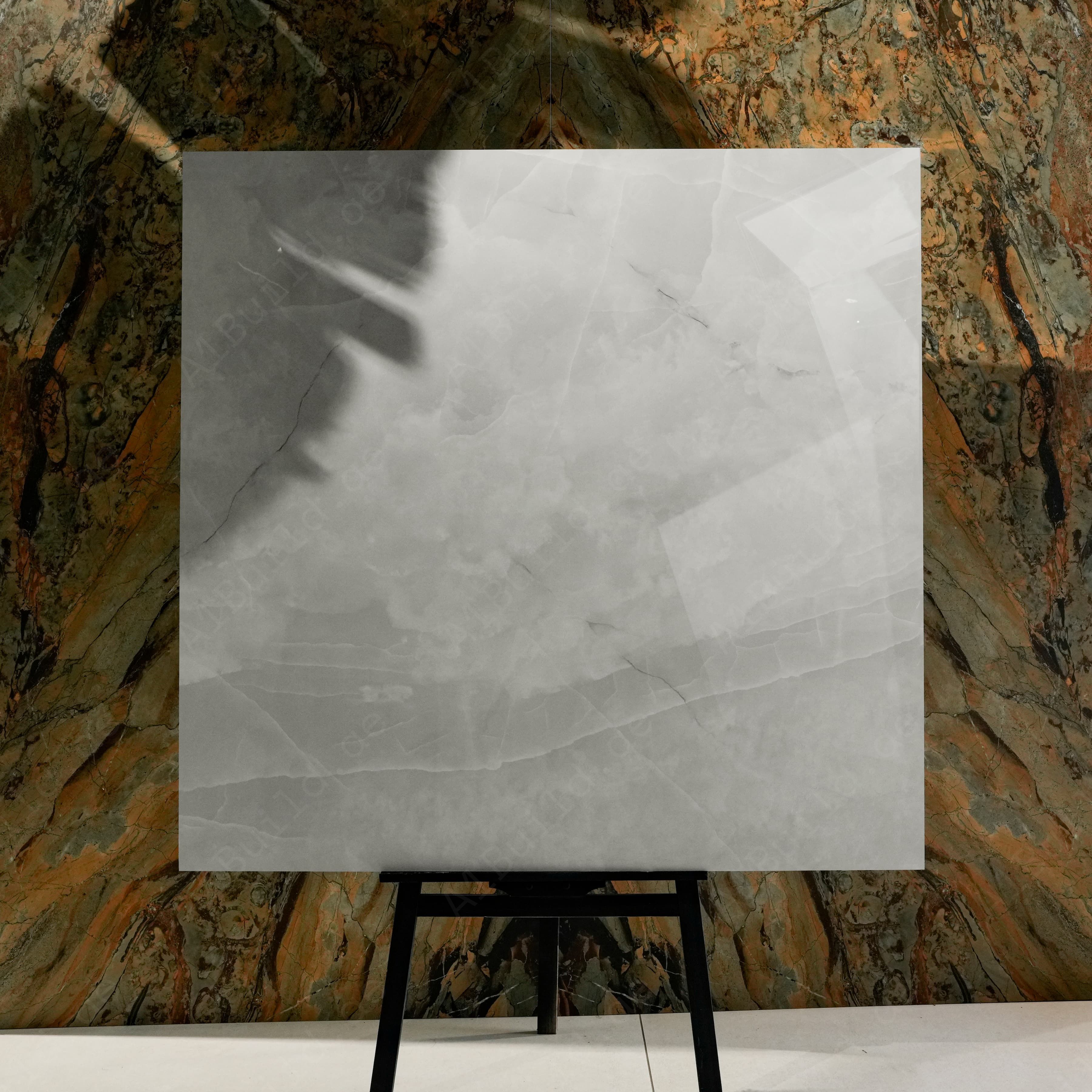 Onyx Lural Glossy 120x120 porcelain tile displayed on easel against natural marble backdrop in UAE showroom