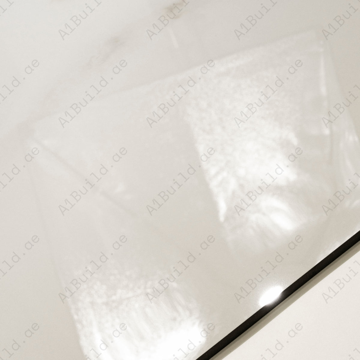 Close-up detail showing the soft gold streaks and mirror-gloss surface of Cecelia Gold porcelain tile