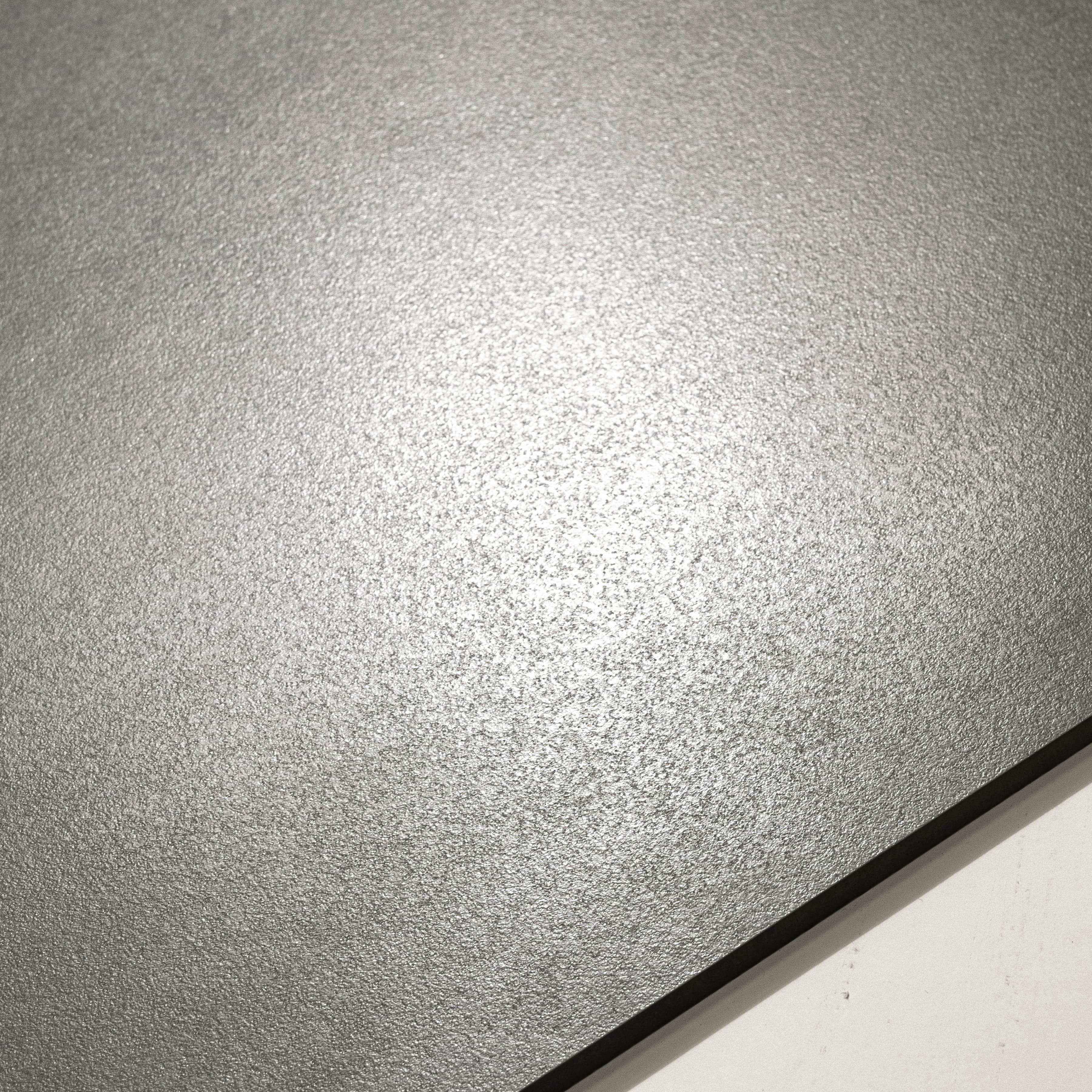 Close-up detail showing the fine matt texture and non-slip surface of Urban Grey porcelain tile