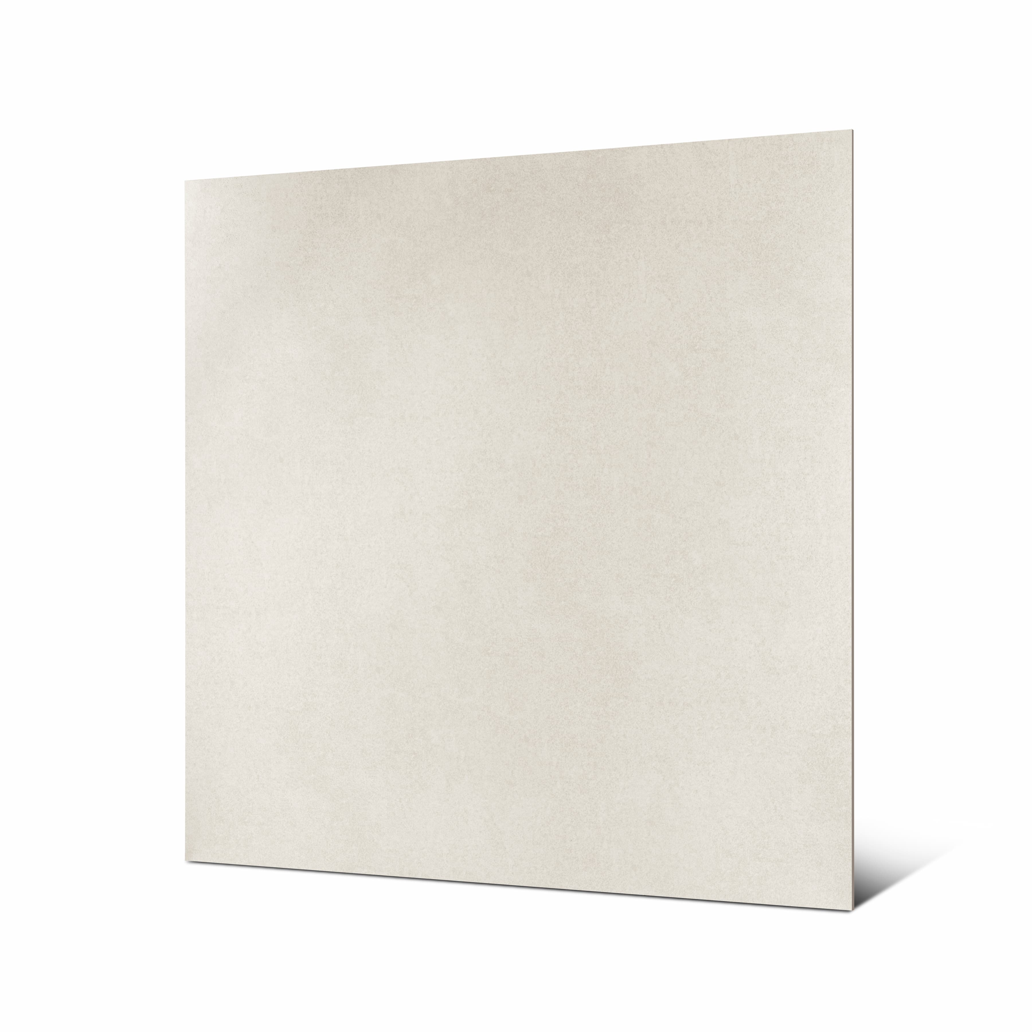 Angled view of Cemento Bianco large format porcelain tile showing soft beige cement texture and rectified edge