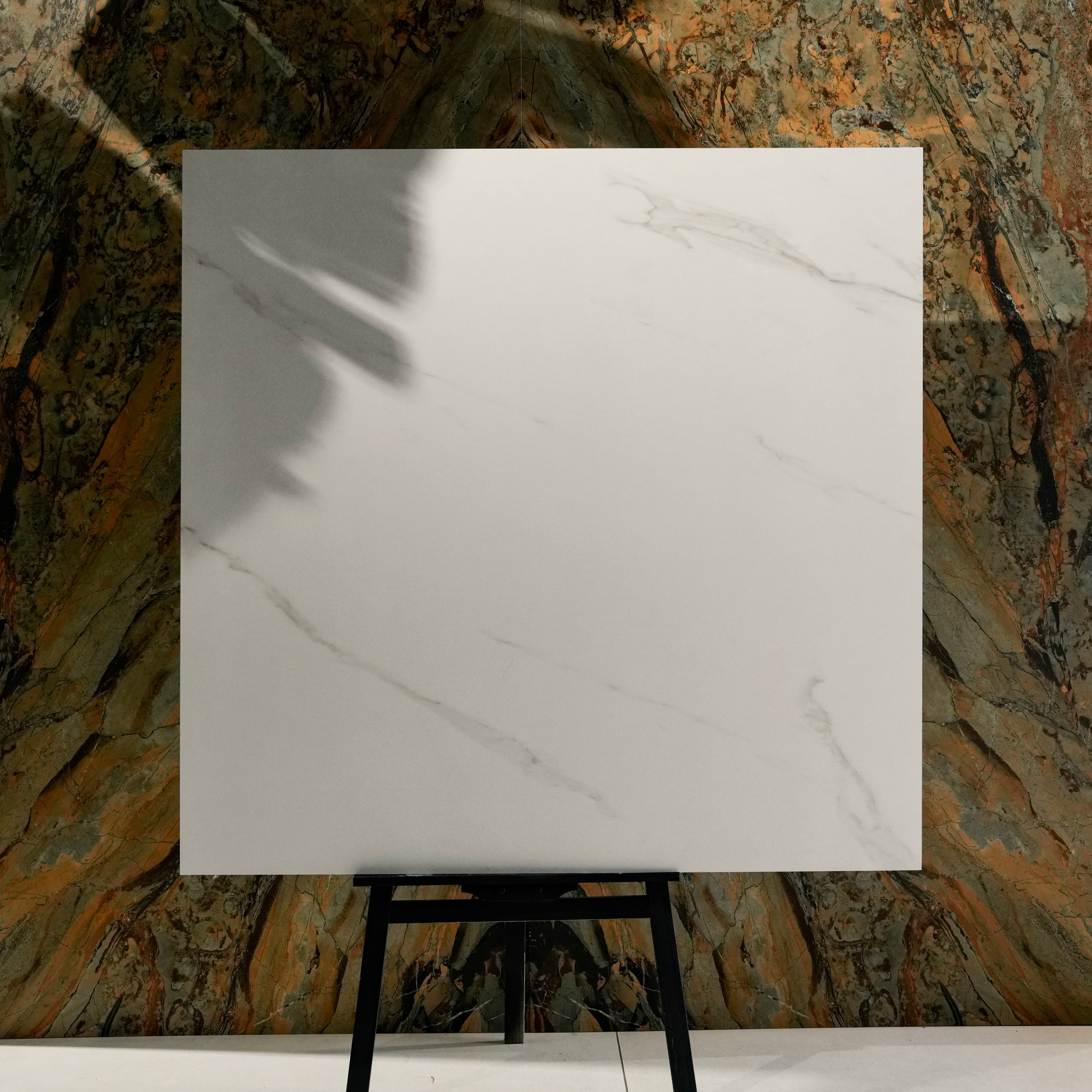 Close-up of Smoke White matte porcelain surface revealing fine sanded marble texture with delicate smoke grey veins
