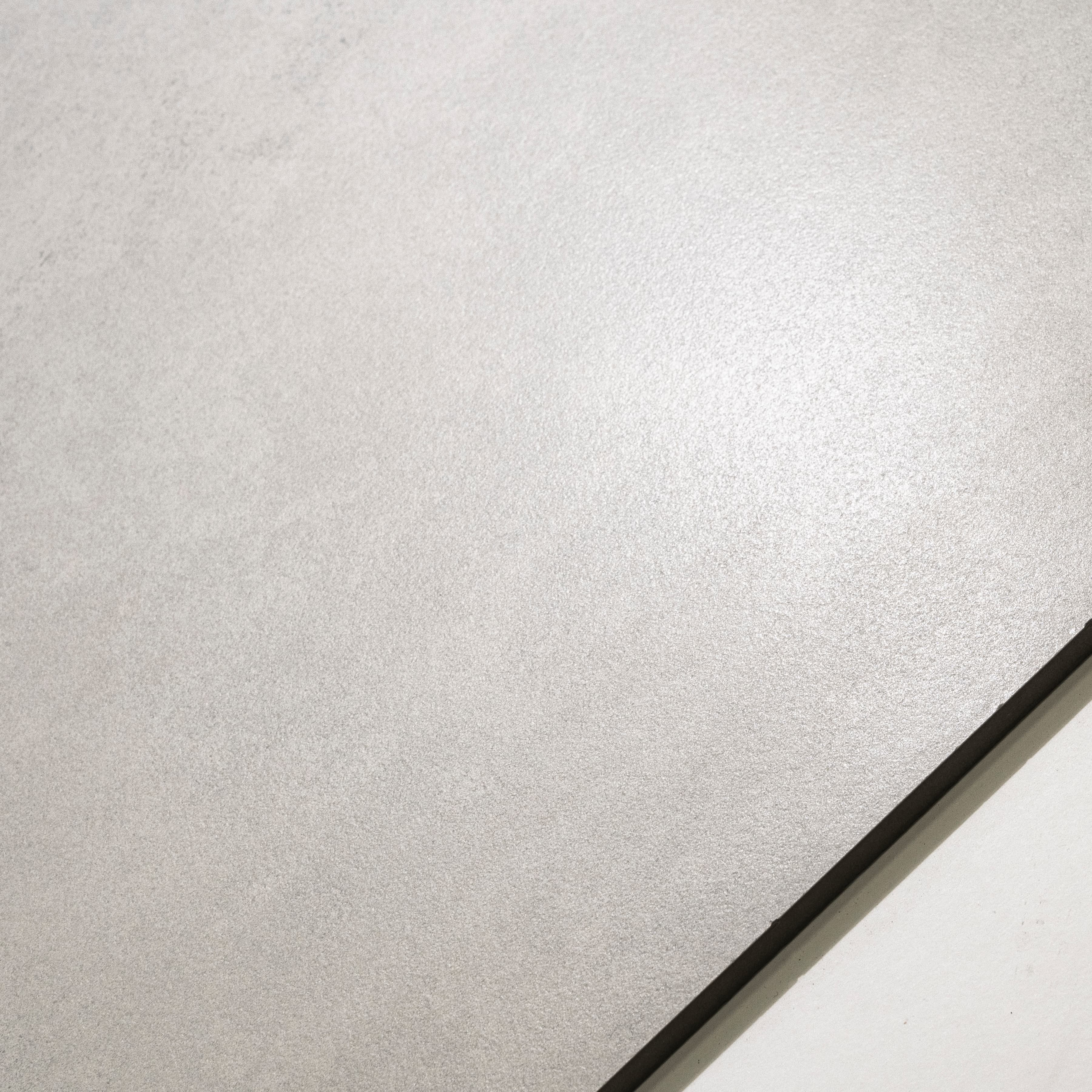 Close-up of Polo White matte porcelain surface revealing fine smooth texture in soft warm white tone