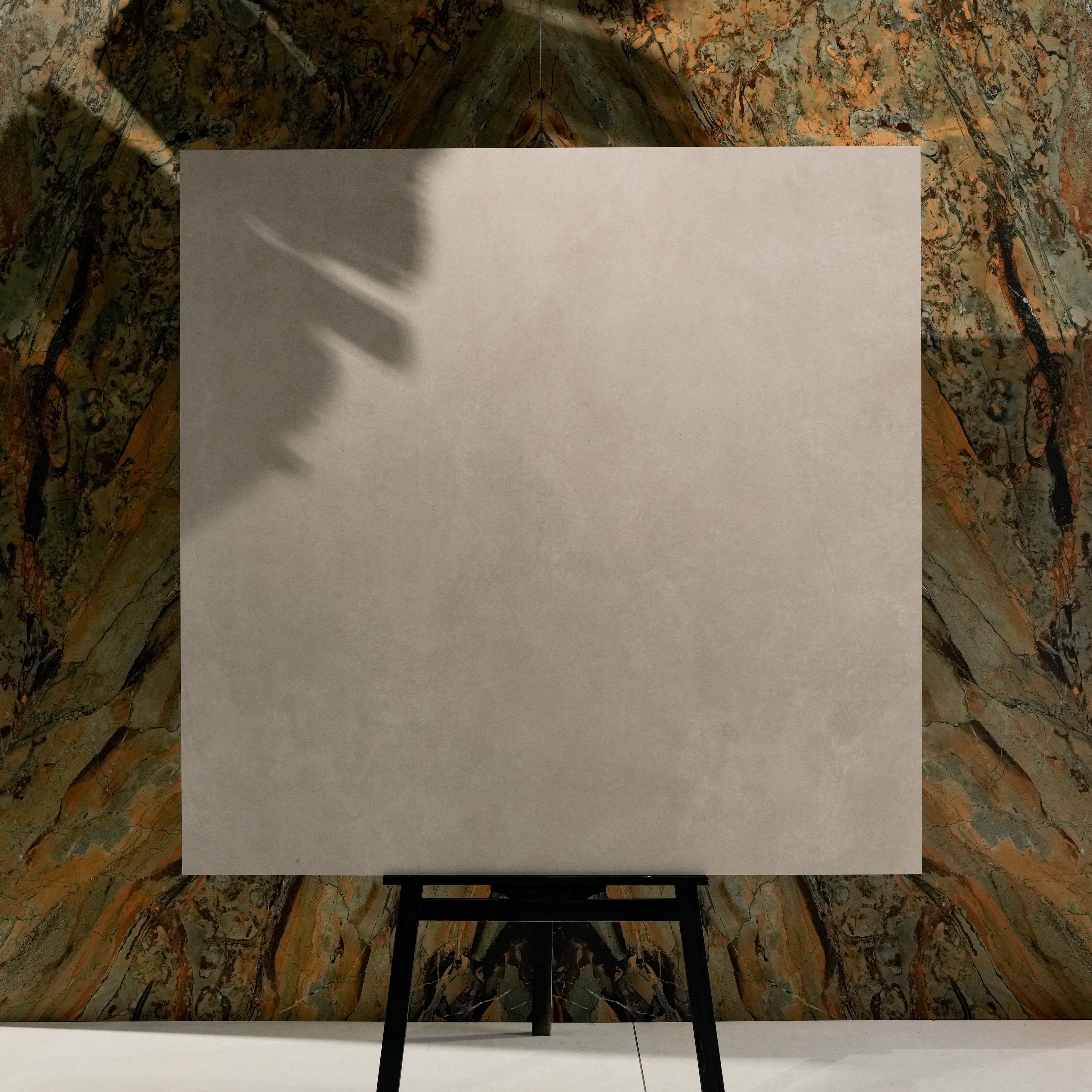 Top view of Azure Grey warm greige porcelain floor tile 120x120cm with subtle cloud-like Mediterranean variation