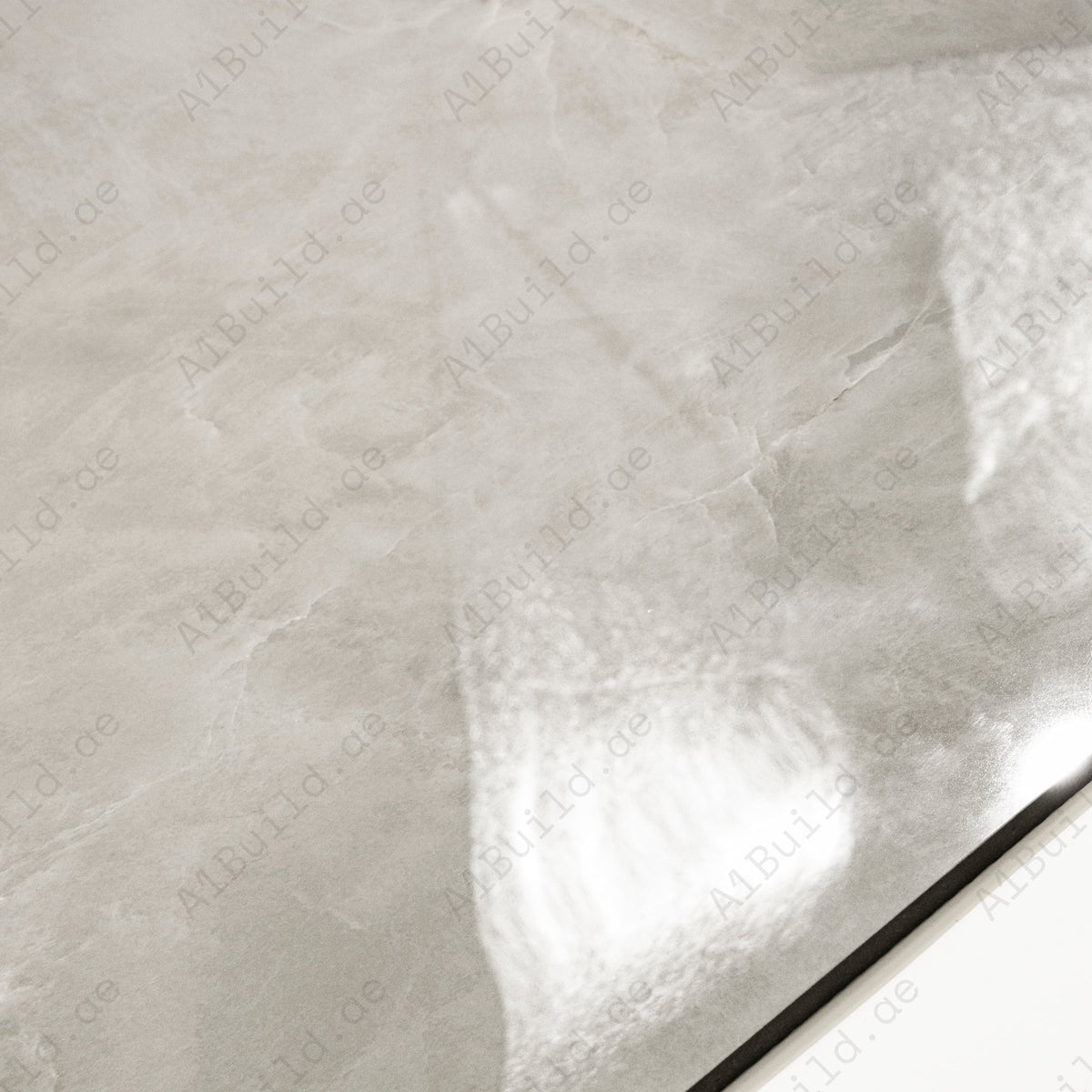 Close-up detail showing the soft veining and mirror-gloss surface of Royal Beige porcelain tile