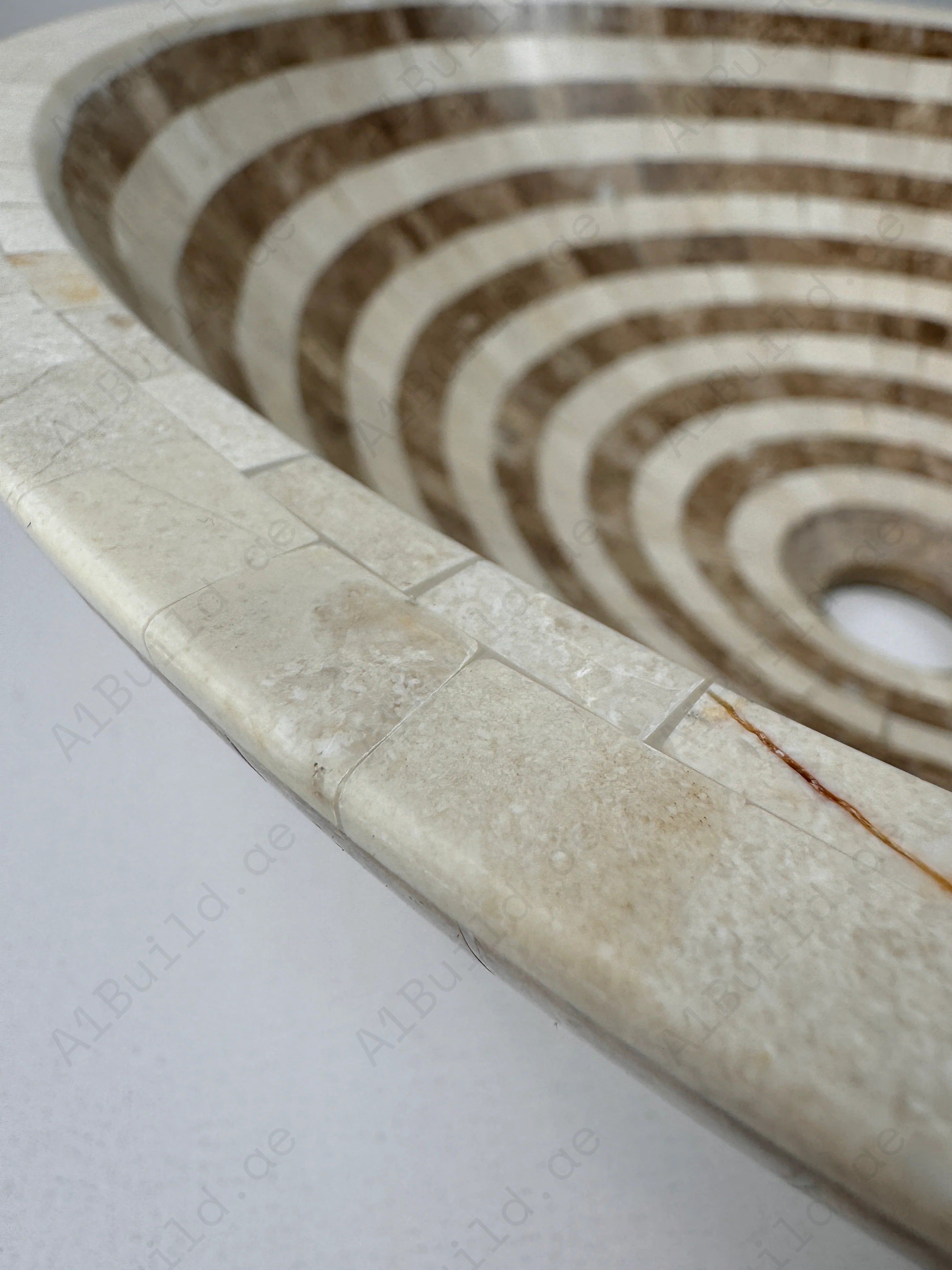 Add timeless charm to your bathroom with the Marble Muse Light Emperador & Crema Marfil Round Marble Basin, blending natural elegance with polished durability.