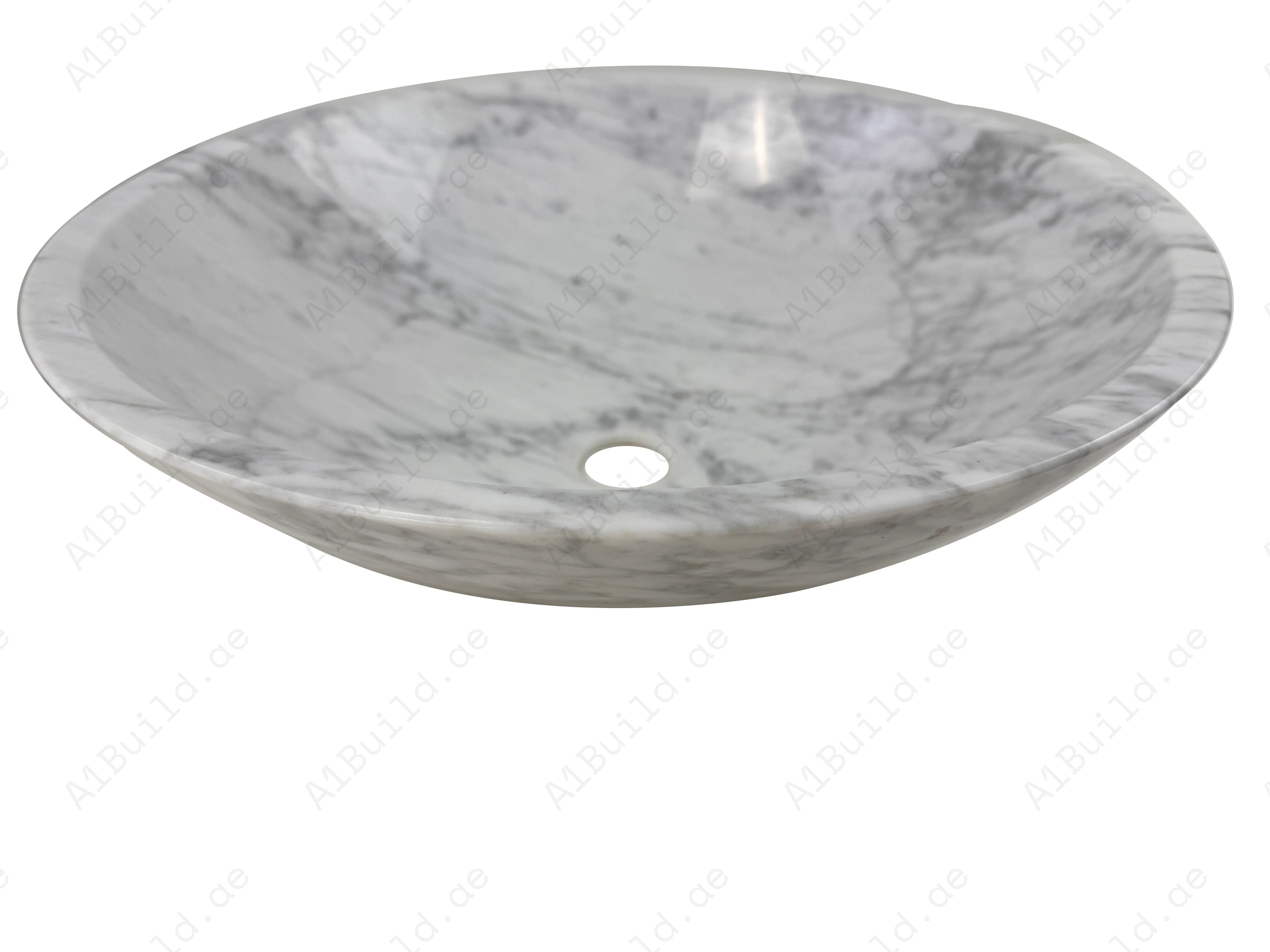 Add timeless elegance to your bathroom with the Marble Muse Carrara White Round Wash Basin, crafted from premium polished marble for lasting beauty and style.