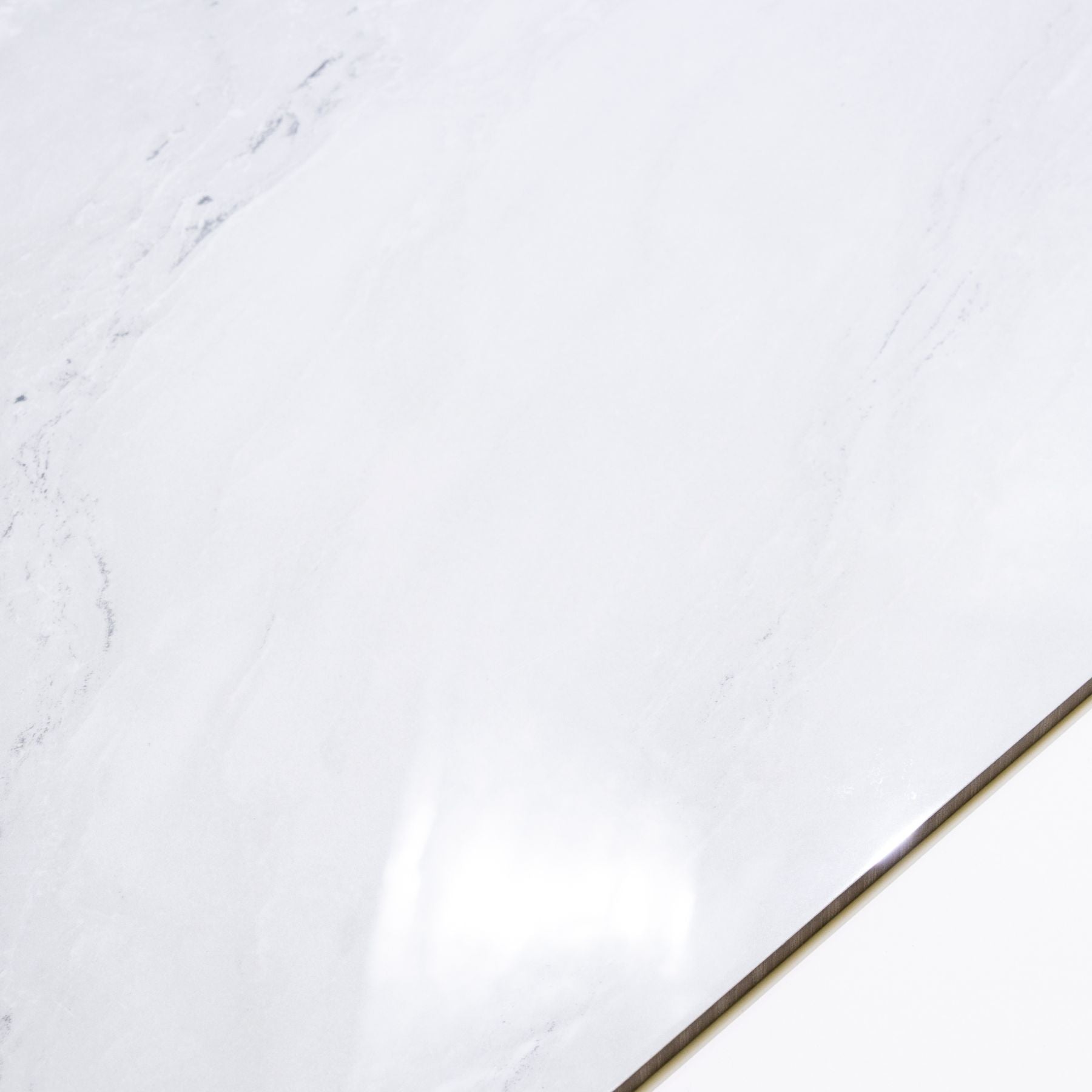 Celeste White glossy marble effect porcelain tile 60x120cm with 9mm thickness features bright white base, soft grey veins and polished finish.