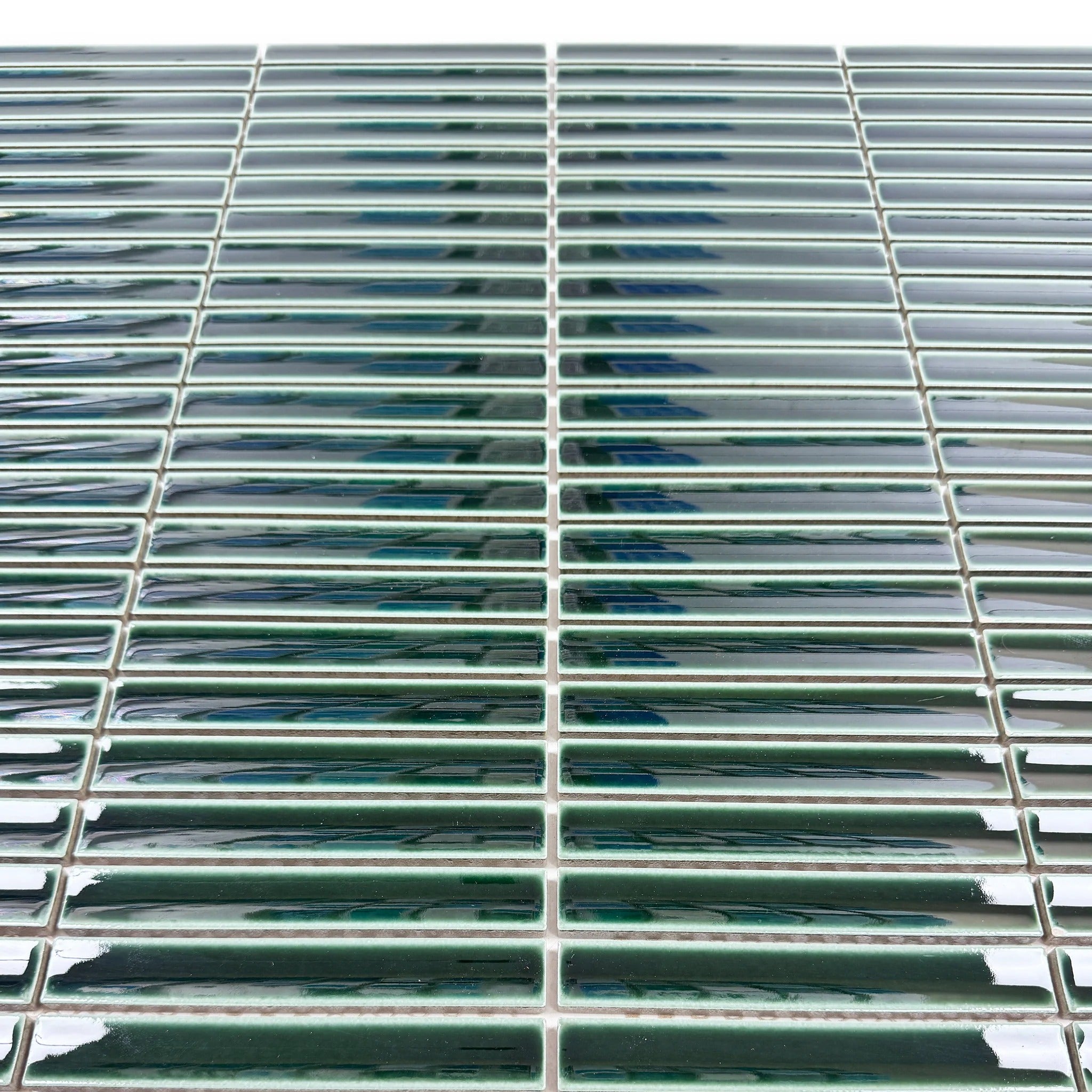 Deep forest green long strip glossy porcelain mosaic adds modern elegance to walls, kitchens, and bathrooms. Durable, moisture-resistant, and easy to install.