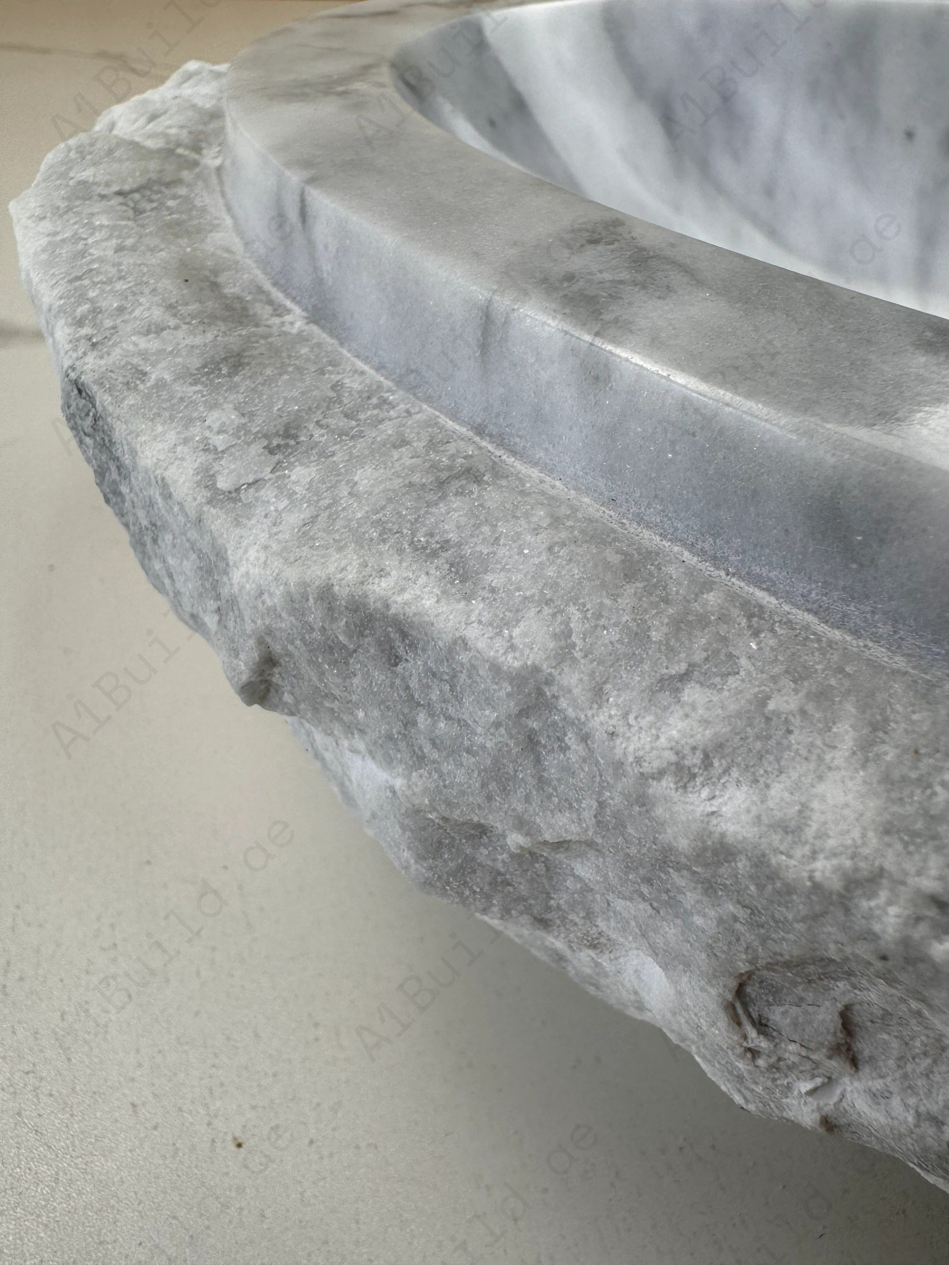 Elevate your bathroom with the Marble Muse Carrara White Natural Elliptical Wash Basin, crafted from premium marble for timeless elegance and lasting beauty.