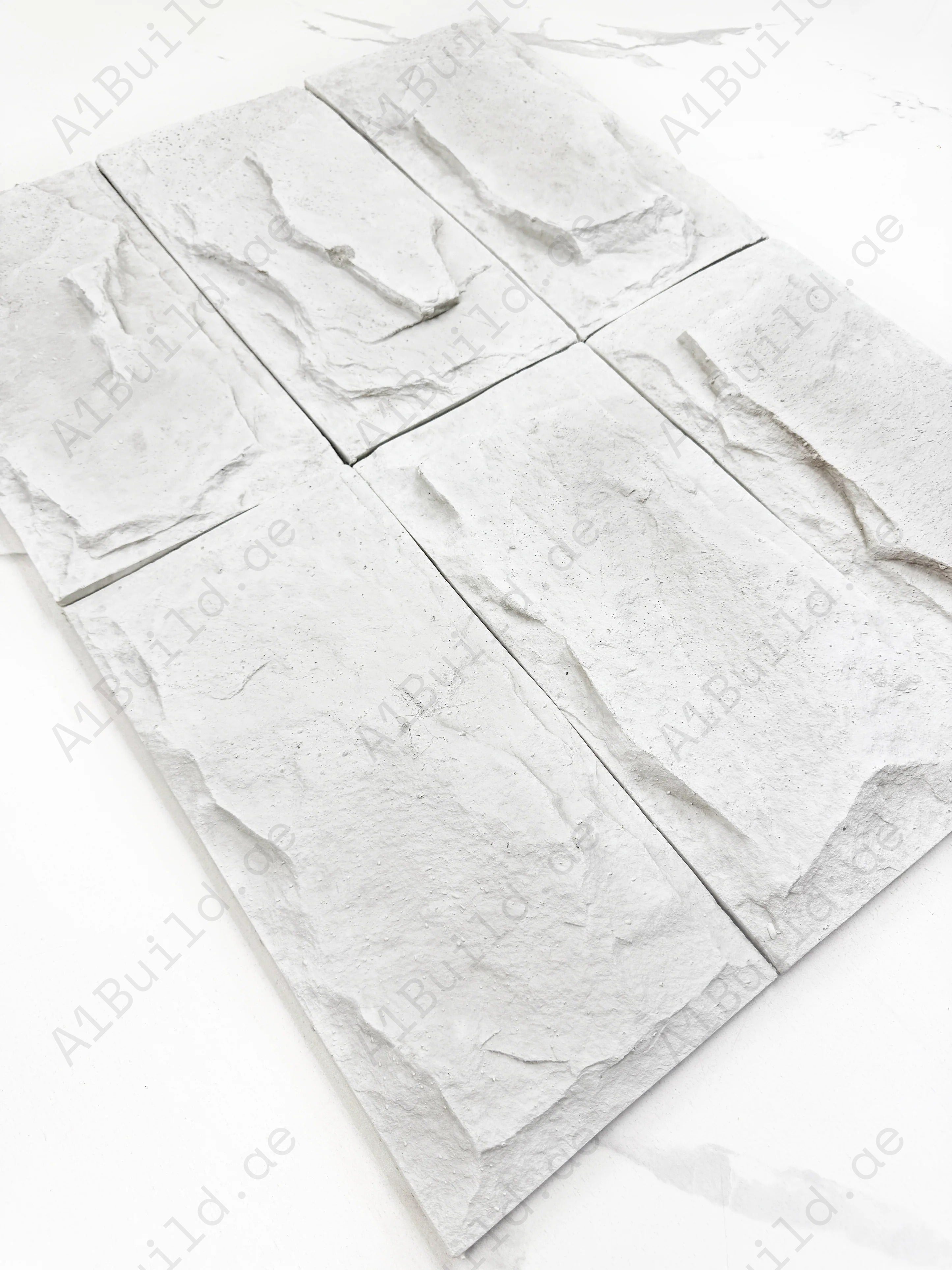 Enhance interiors with Tuscany Essence White Mushroom Stone Design Cement Artificial Tile. Durable, elegant, and ideal for walls with natural stone appeal.