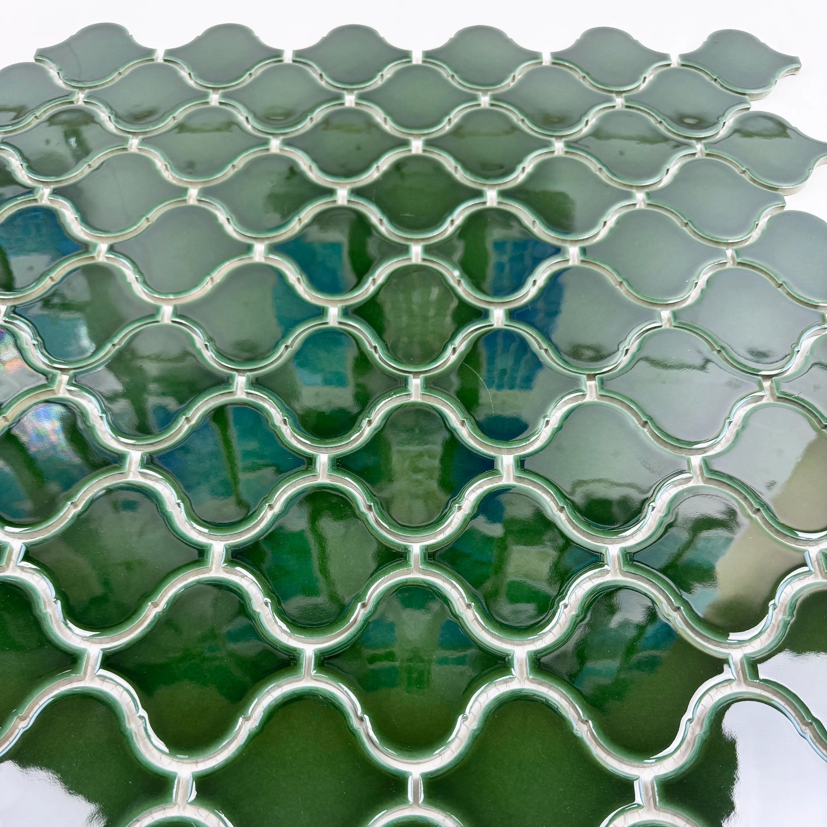 Lantern-inspired emerald green glossy porcelain mosaic. Perfect for walls, backsplashes, and interiors, offering vibrant color, durability, and easy upkeep.