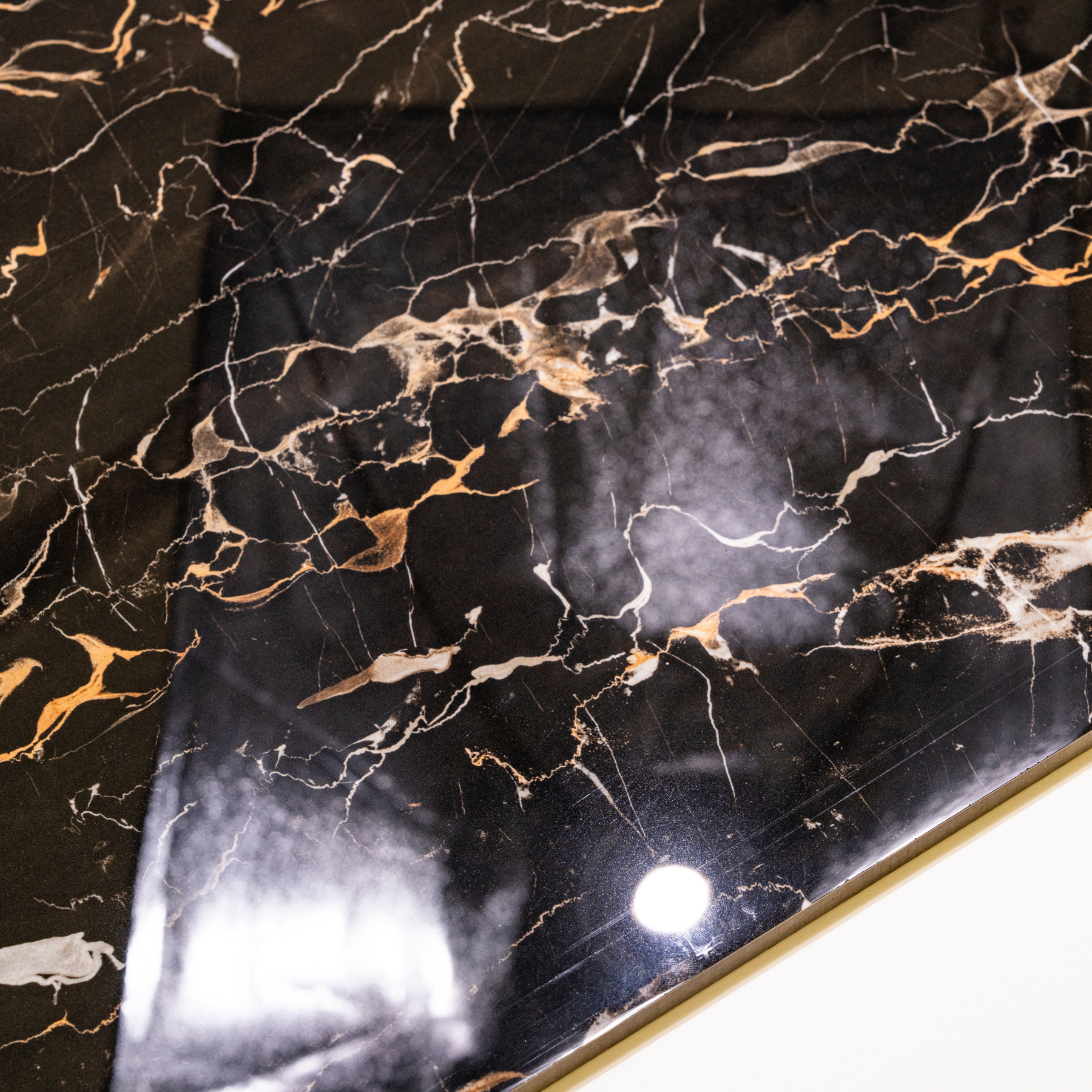 Portoro Gold porcelain tile 60x120cm 9mm thickness, black marble look with gold veining, durable porcelain tile for luxury floors and walls.