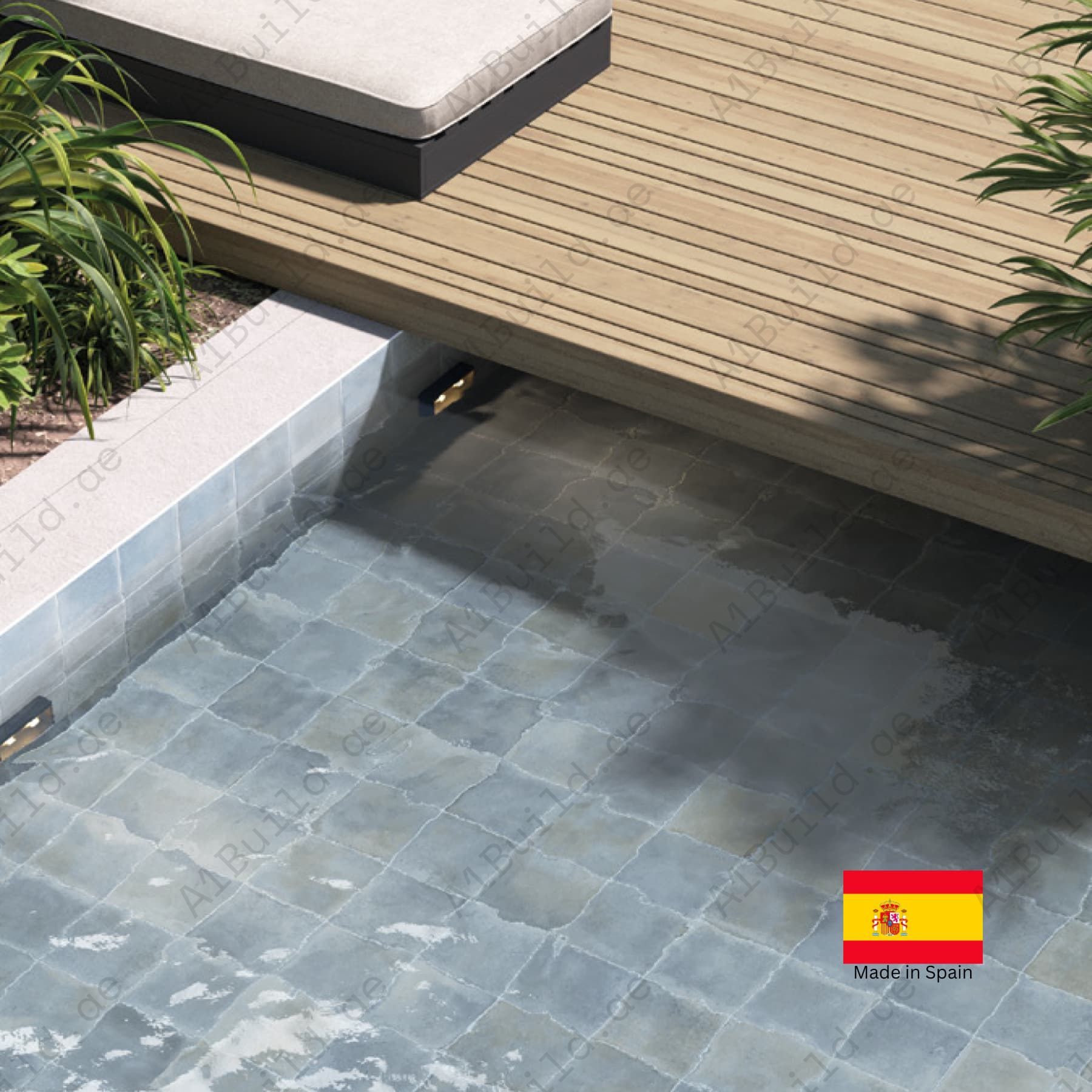 Small pool with tiled floor next to a wooden deck, with a Spanish flag indicating 'Made in Spain'.