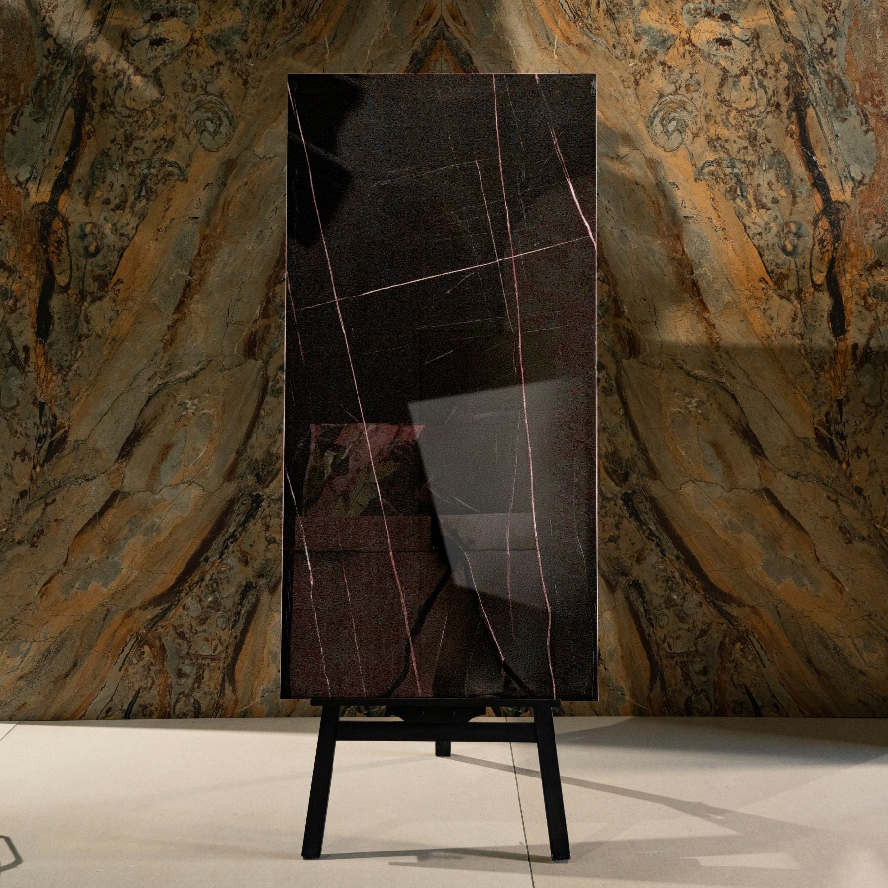 St Laurent glossy marble effect porcelain tile 60x120cm with 9mm thickness features black base with gold veining and polished finish.