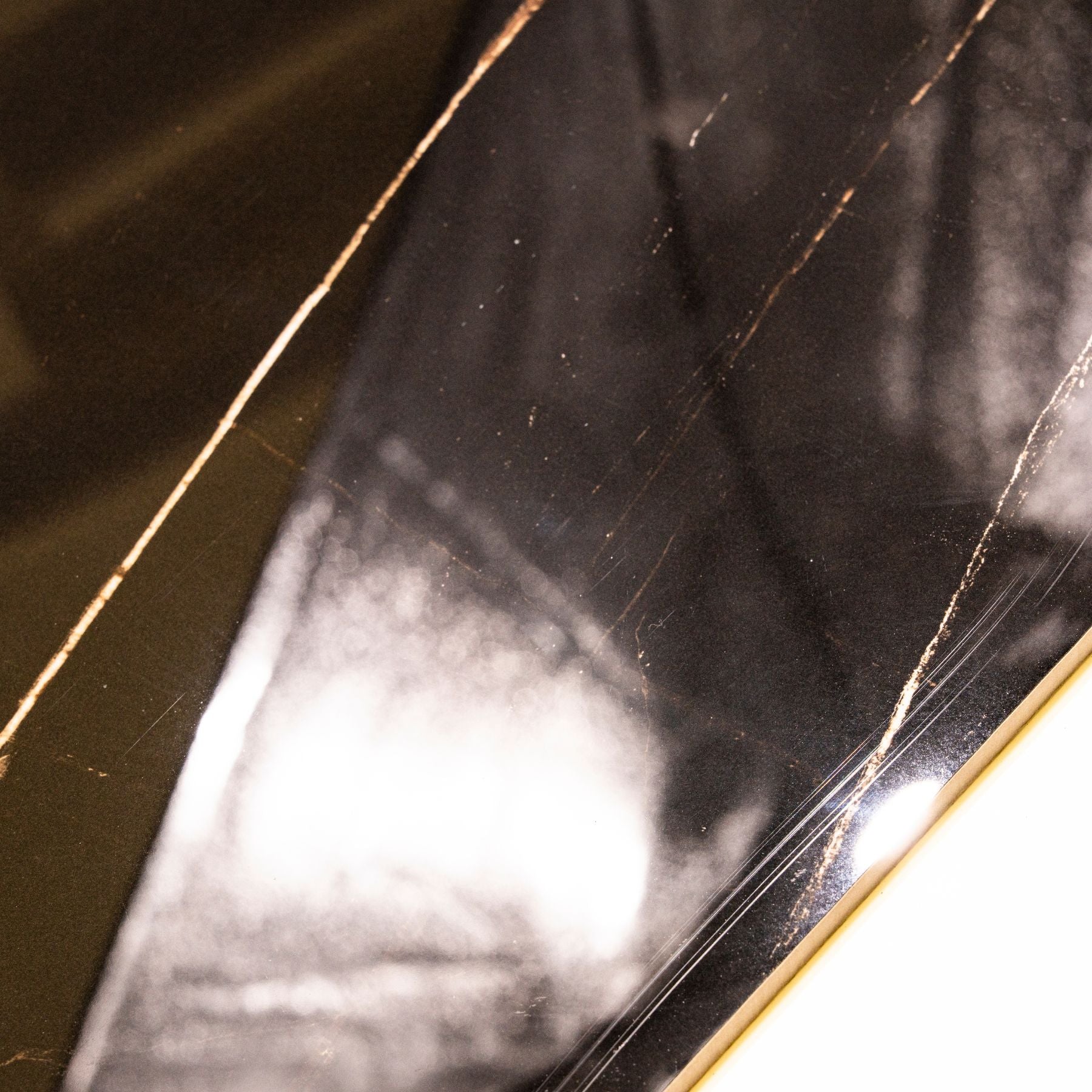 St Laurent glossy marble effect porcelain tile 60x120cm with 9mm thickness features black base with gold veining and polished finish.