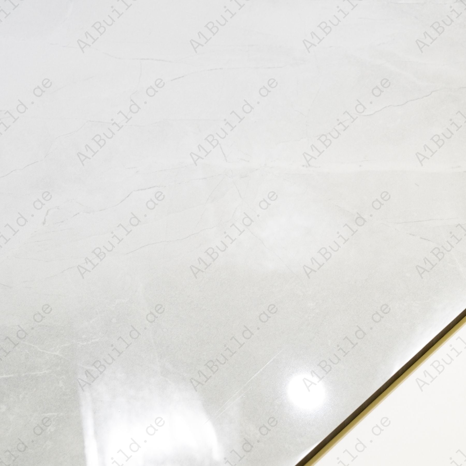Unica White glossy marble effect porcelain tile 60x120cm with 9mm thickness features bright white tones, subtle marble veining and polished finish.
