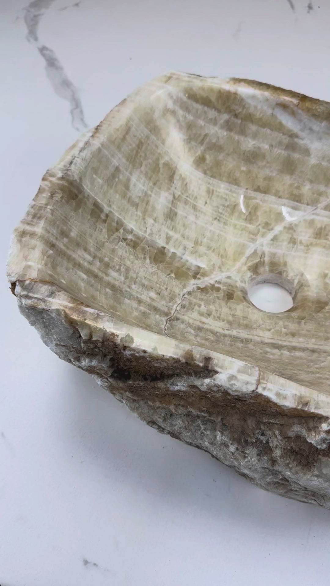 Add a touch of luxury with the Marble Muse Yellow Onyx Irregular Wash Basin, crafted from natural marble for timeless beauty, unique form & lasting durability.