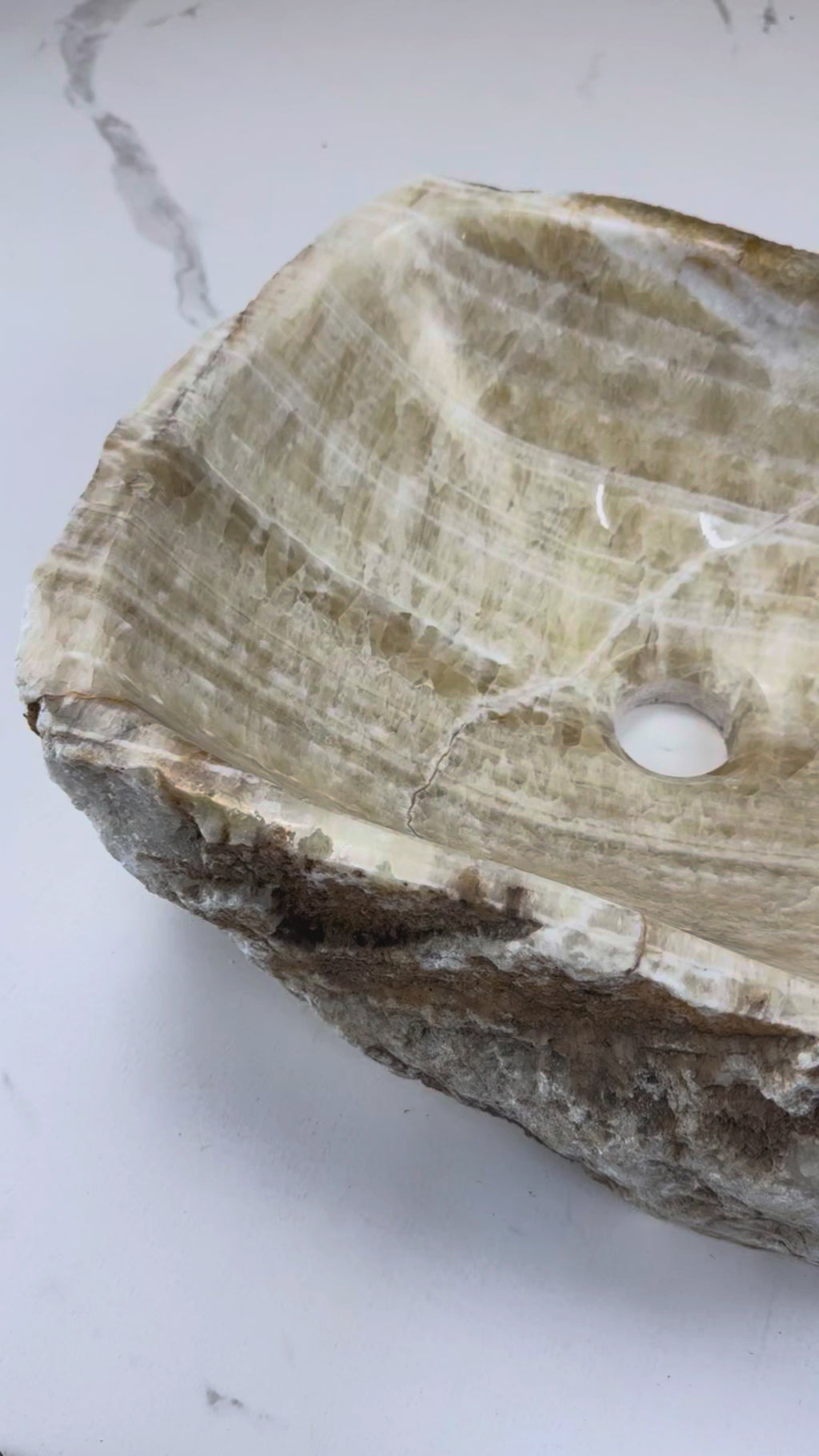 Add a touch of luxury with the Marble Muse Yellow Onyx Irregular Wash Basin, crafted from natural marble for timeless beauty, unique form & lasting durability.