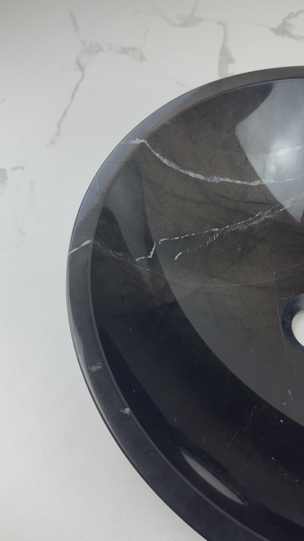 Elevate your bathroom with the Marble Muse Black Marquina Polished Round Wash Basin, crafted from premium marble for bold elegance and timeless appeal.